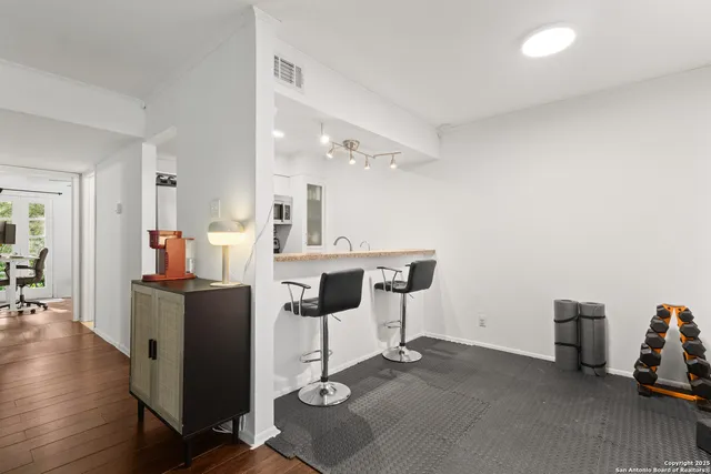 a view of kitchen with furniture and wooden floor