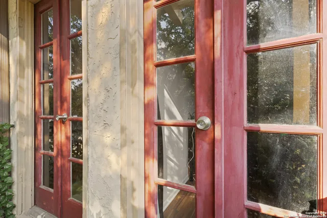 a view of a bathroom from a glass door