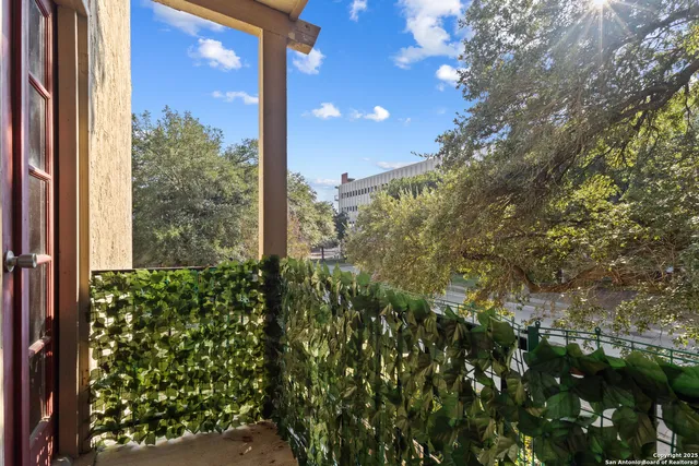 a view of a city from a tree