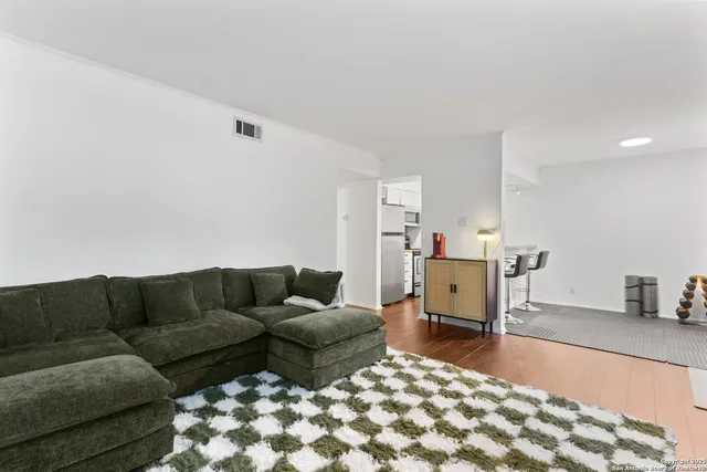 a living room with furniture and a couch