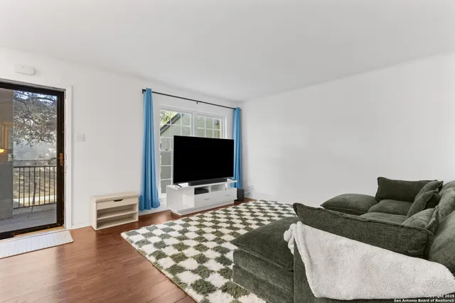 a living room with a couch and a flat screen tv