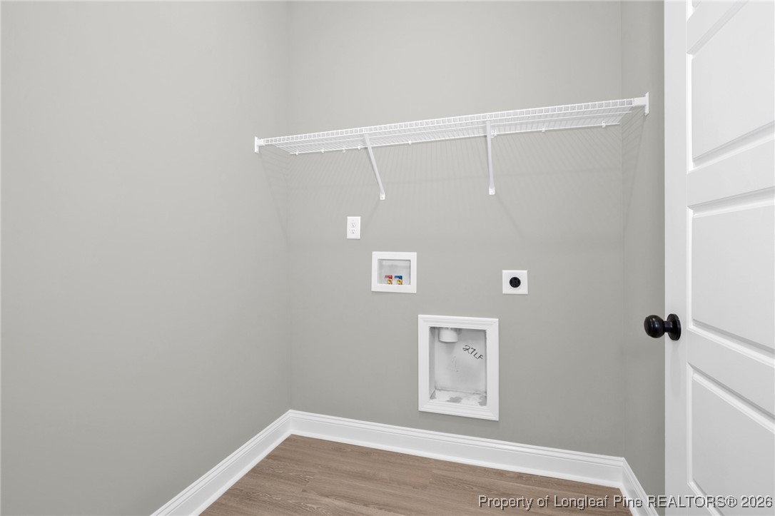 307 Barberry Road Raeford, NC 28376 - Photo 24 of 38 a view of room with window and wooden floor