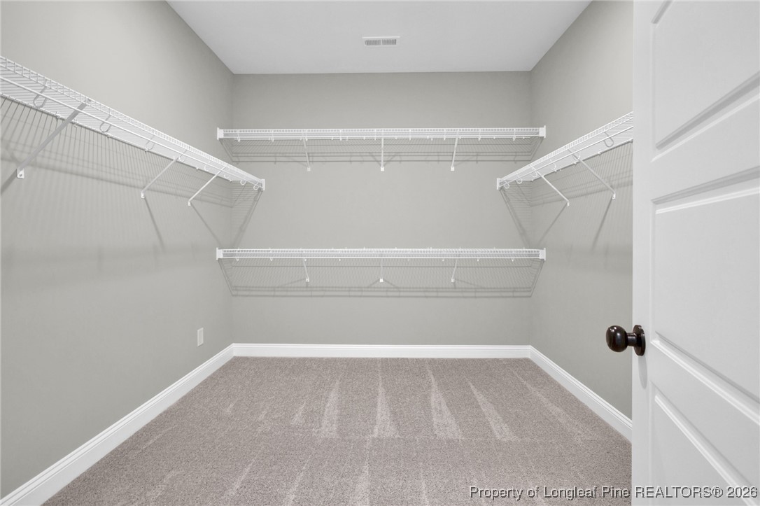 307 Barberry Road Raeford, NC 28376 - Photo 33 of 38 a view of a room with racks on the wall