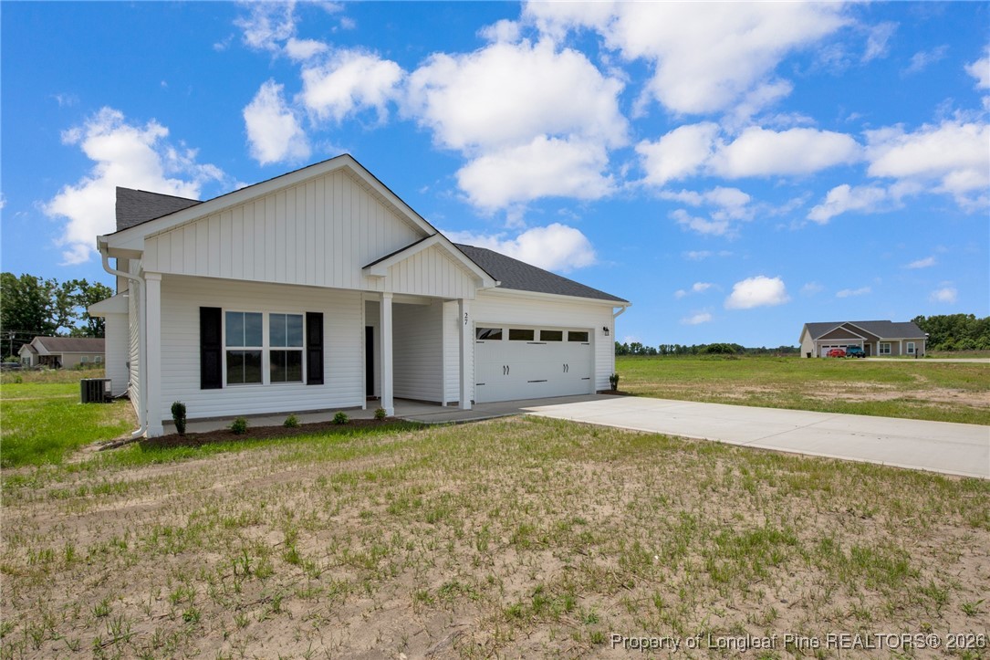 307 Barberry Road Raeford, NC 28376 - Photo 9 of 38 a view of a house with backyard and garden