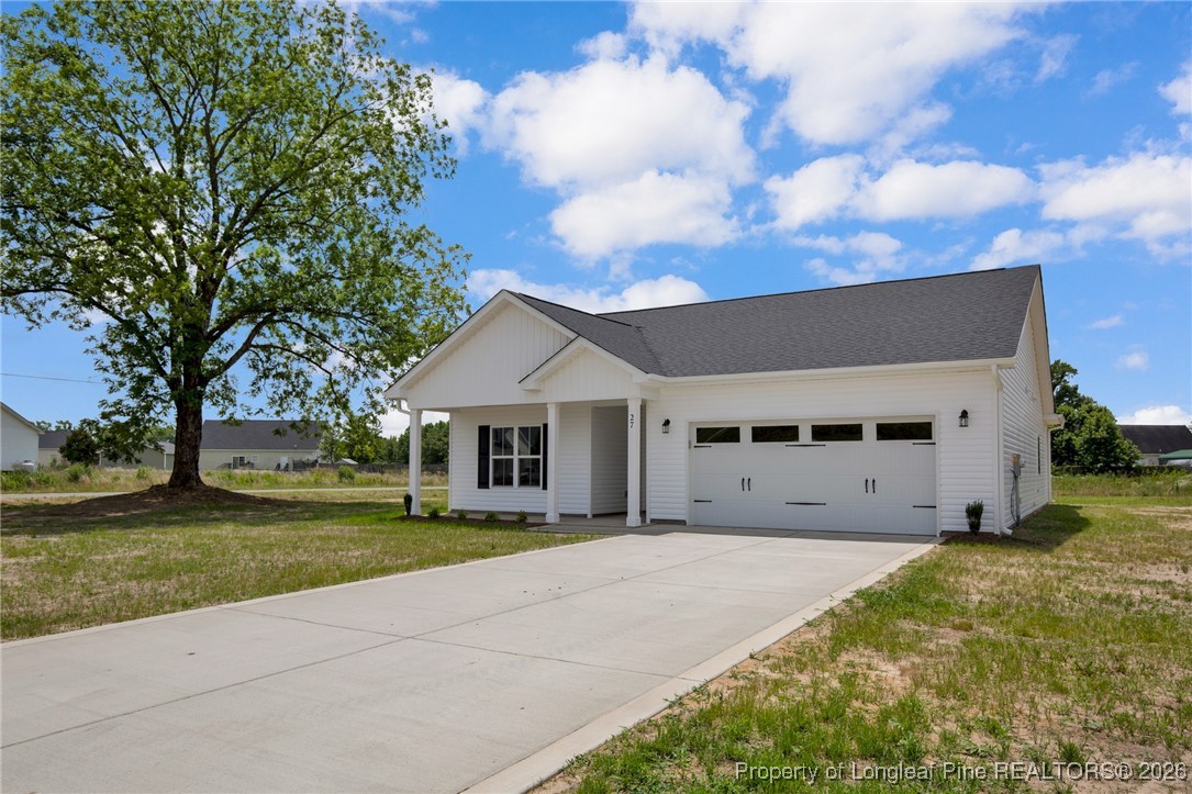 307 Barberry Road Raeford, NC 28376 - Photo 10 of 38 a view of a house with yard and a tree