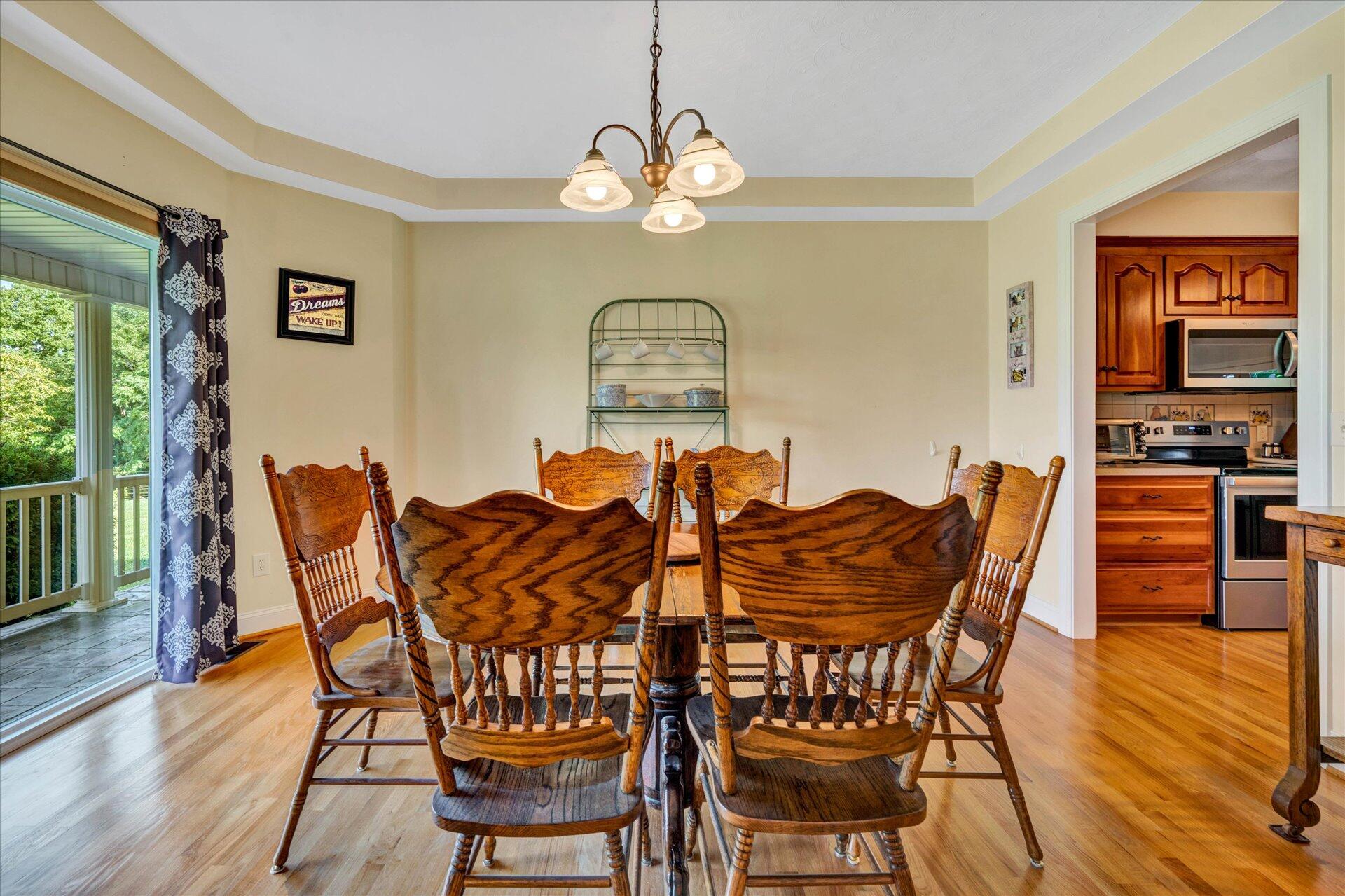 325 Rock Ridge Road Callaway, VA 24067 - Photo 13 of 74 a view of a dining room with furniture and wooden floor