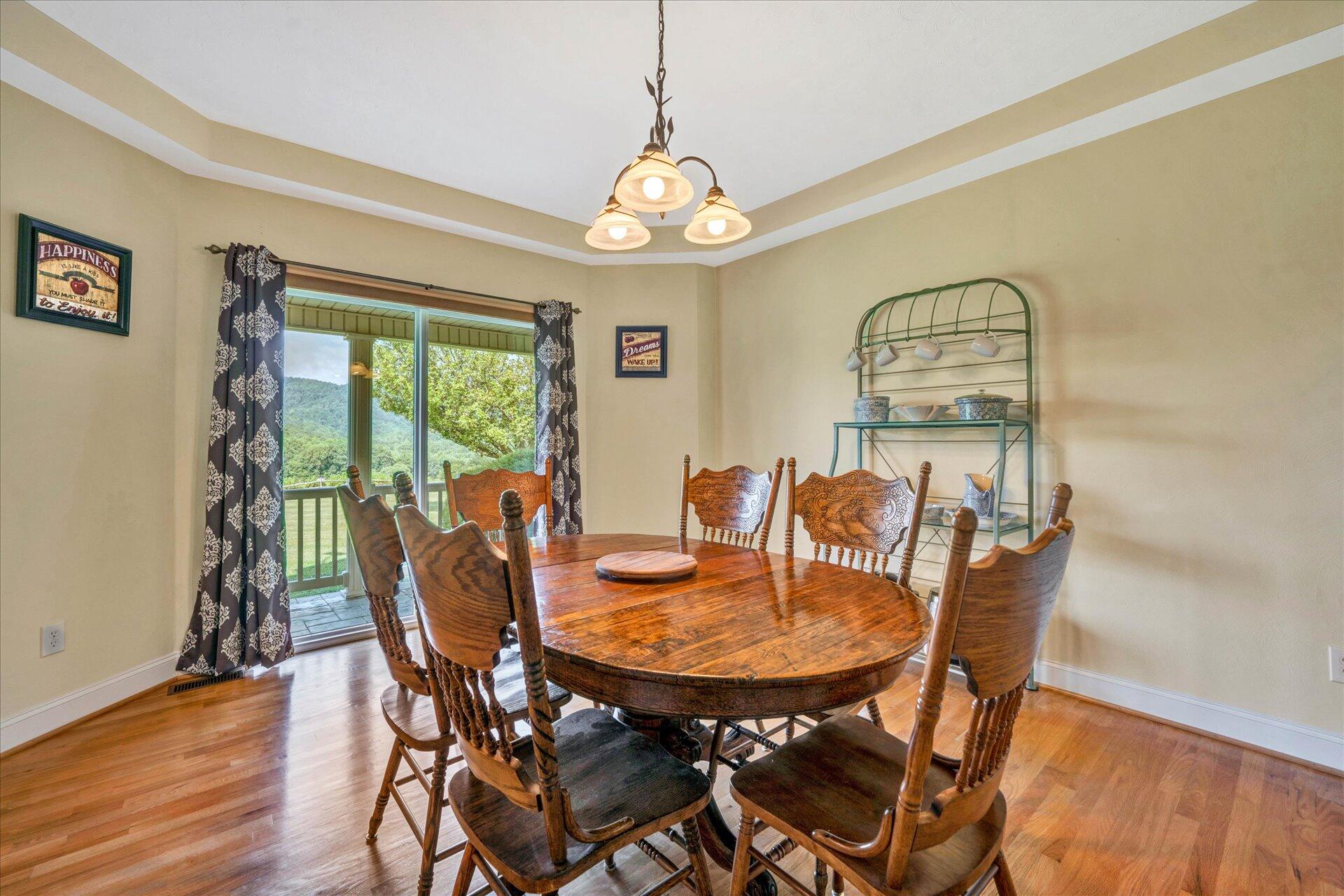 325 Rock Ridge Road Callaway, VA 24067 - Photo 14 of 74 a view of a dining room with furniture window and wooden floor