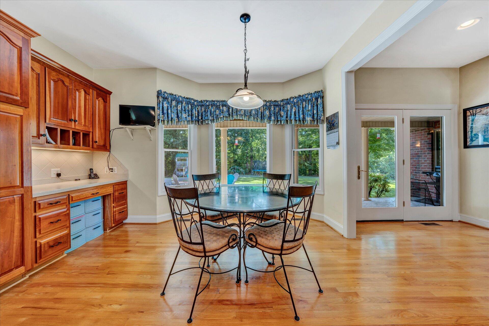 325 Rock Ridge Road Callaway, VA 24067 - Photo 20 of 74 a dining room with furniture a chandelier and wooden floor