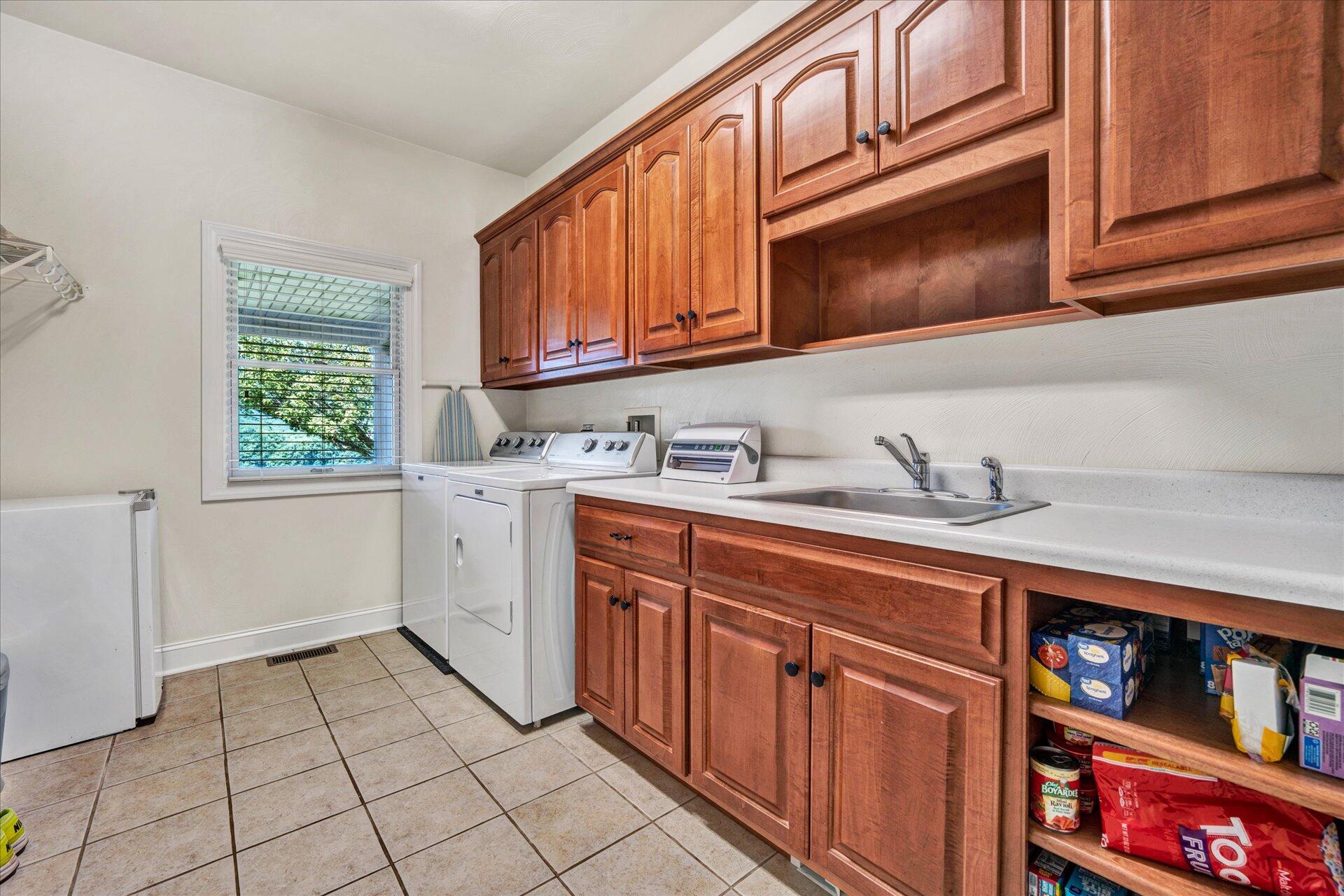 325 Rock Ridge Road Callaway, VA 24067 - Photo 26 of 74 a utility room with cabinets a washer and dryer