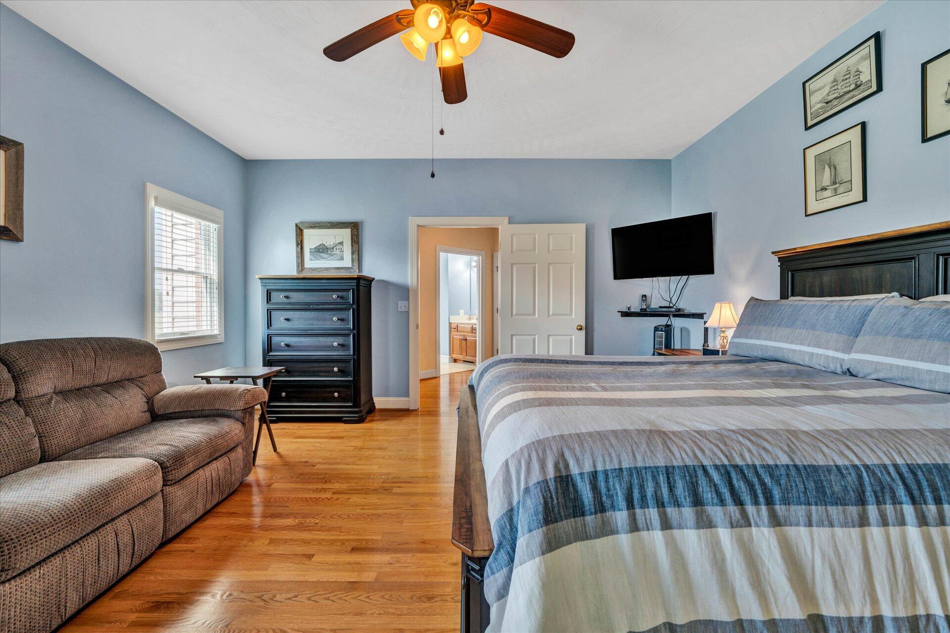 325 Rock Ridge Road Callaway, VA 24067 - Photo 30 of 74 a bedroom with a bed and wooden floor