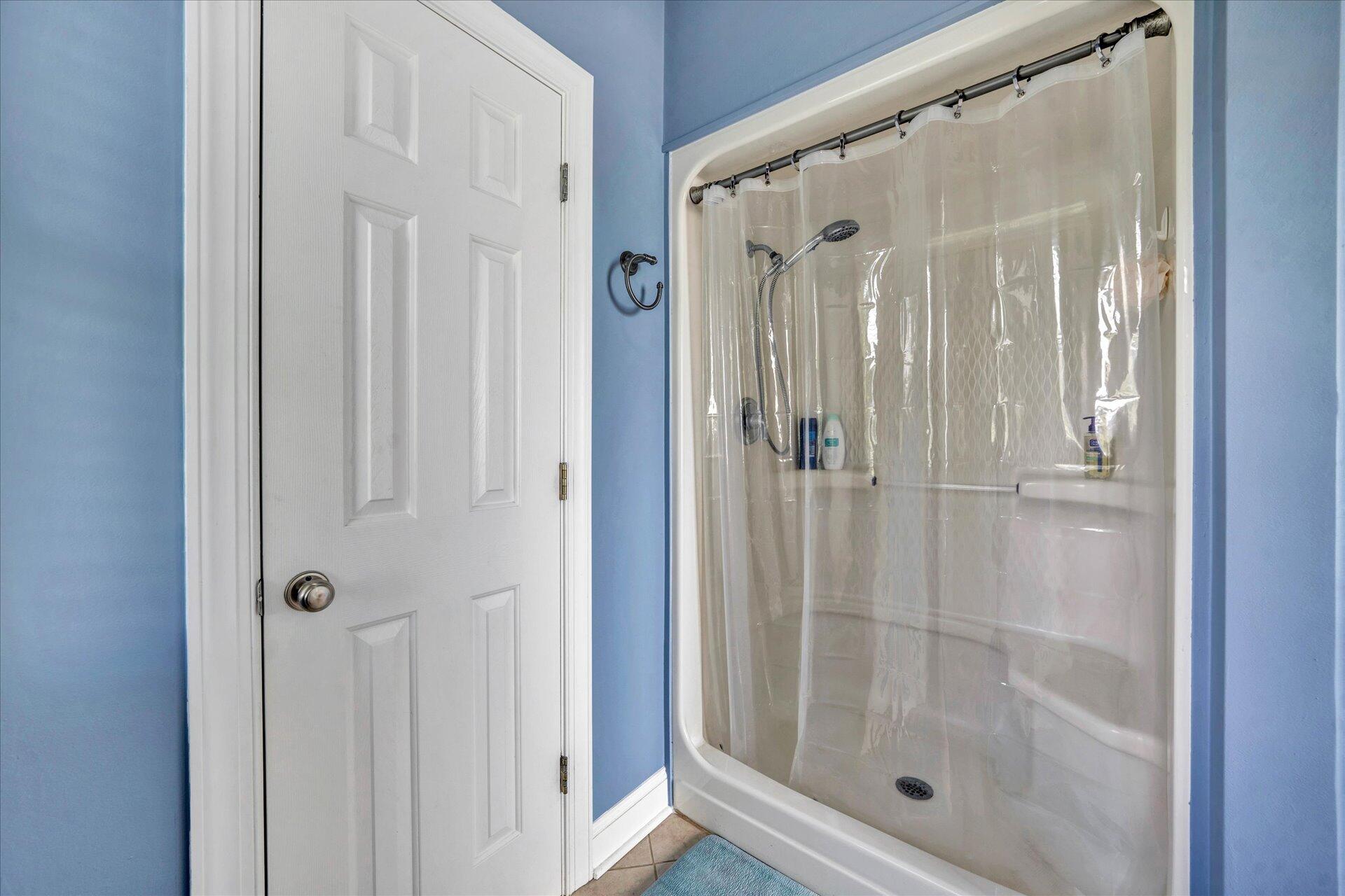 325 Rock Ridge Road Callaway, VA 24067 - Photo 36 of 74 a bathroom with a glass shower door