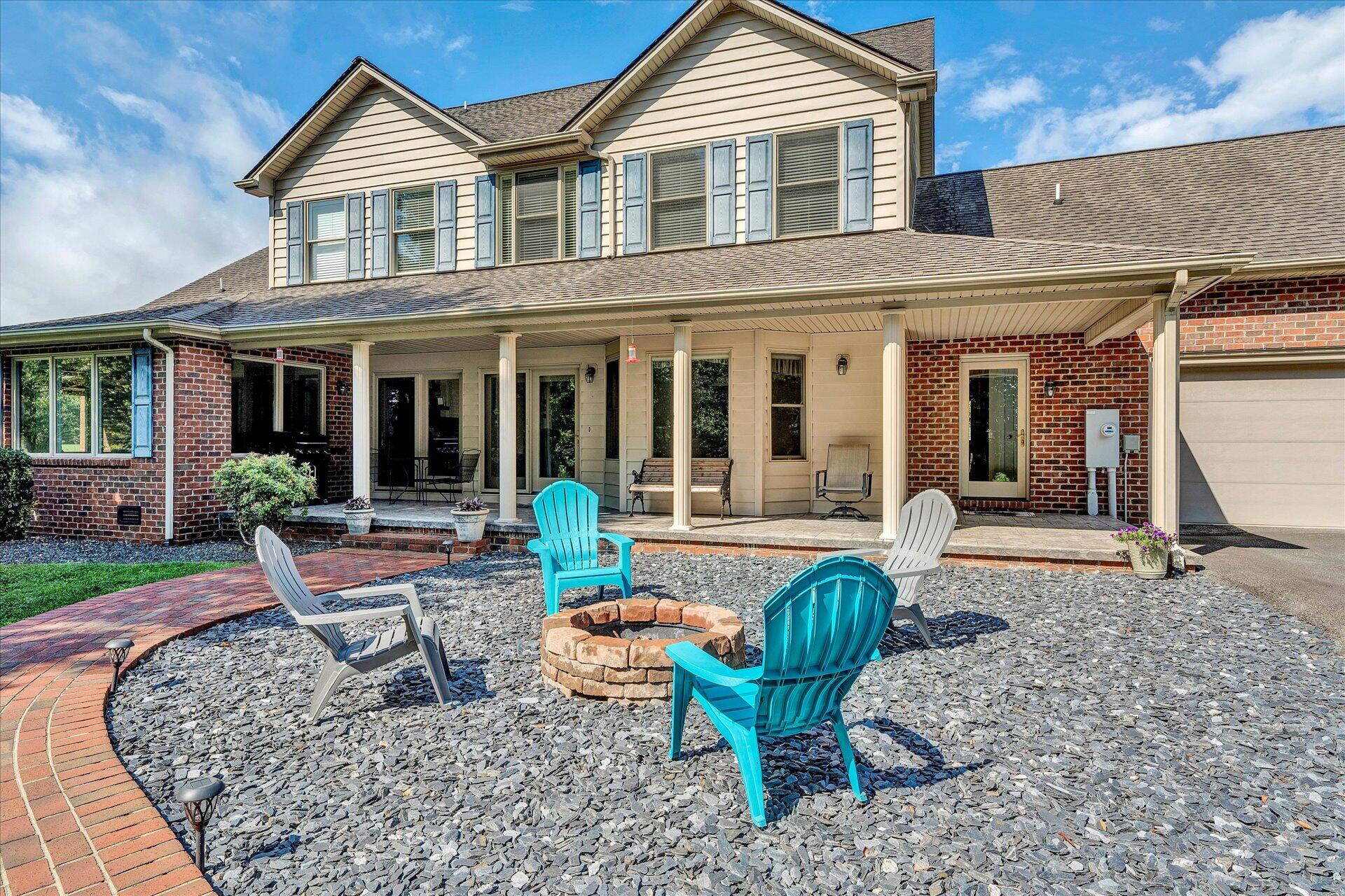 325 Rock Ridge Road Callaway, VA 24067 - Photo 55 of 74 a view of a house with backyard sitting area and garden