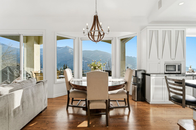 1878 East Ridge Point Drive Bountiful, UT 84010 - Photo 9 of 92 Dining space with hanging lights, light wood finished floors, and a mountain view