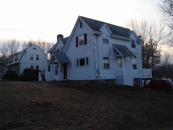 136 North Main Street Sharon, MA 02067 - Photo 2 of 18 a front view of a house with a garden