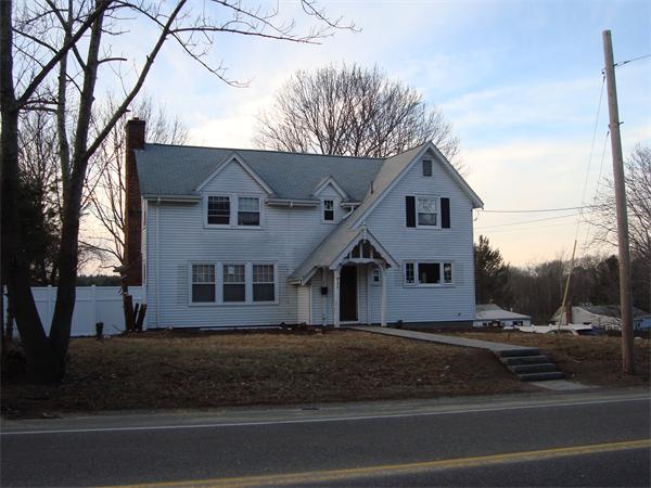 136 North Main Street Sharon, MA 02067 - Photo 3 of 18 a front view of a house with a yard