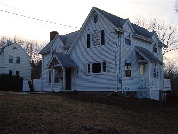 136 North Main Street Sharon, MA 02067 - Photo 4 of 18 a front view of a house with a garden
