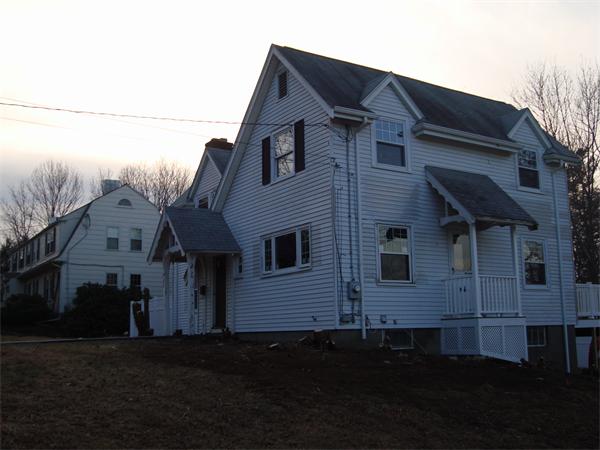 136 North Main Street Sharon, MA 02067 - Photo 5 of 18 a front view of a house with a yard