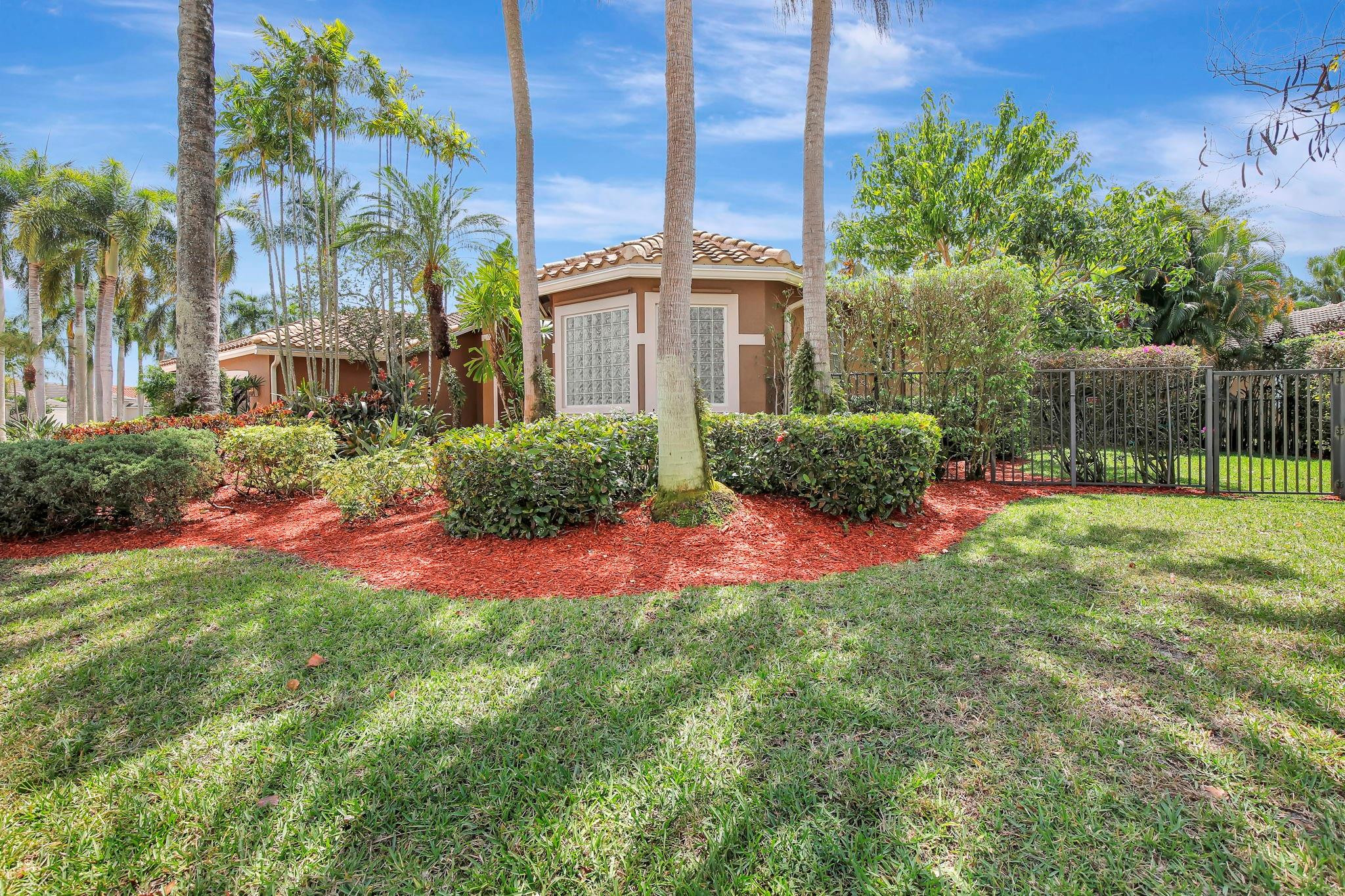 2529 Eagle Run Circle Fort Lauderdale, FL 33327 - Photo 14 of 74 a front view of a multi story residential apartment building with yard and bench