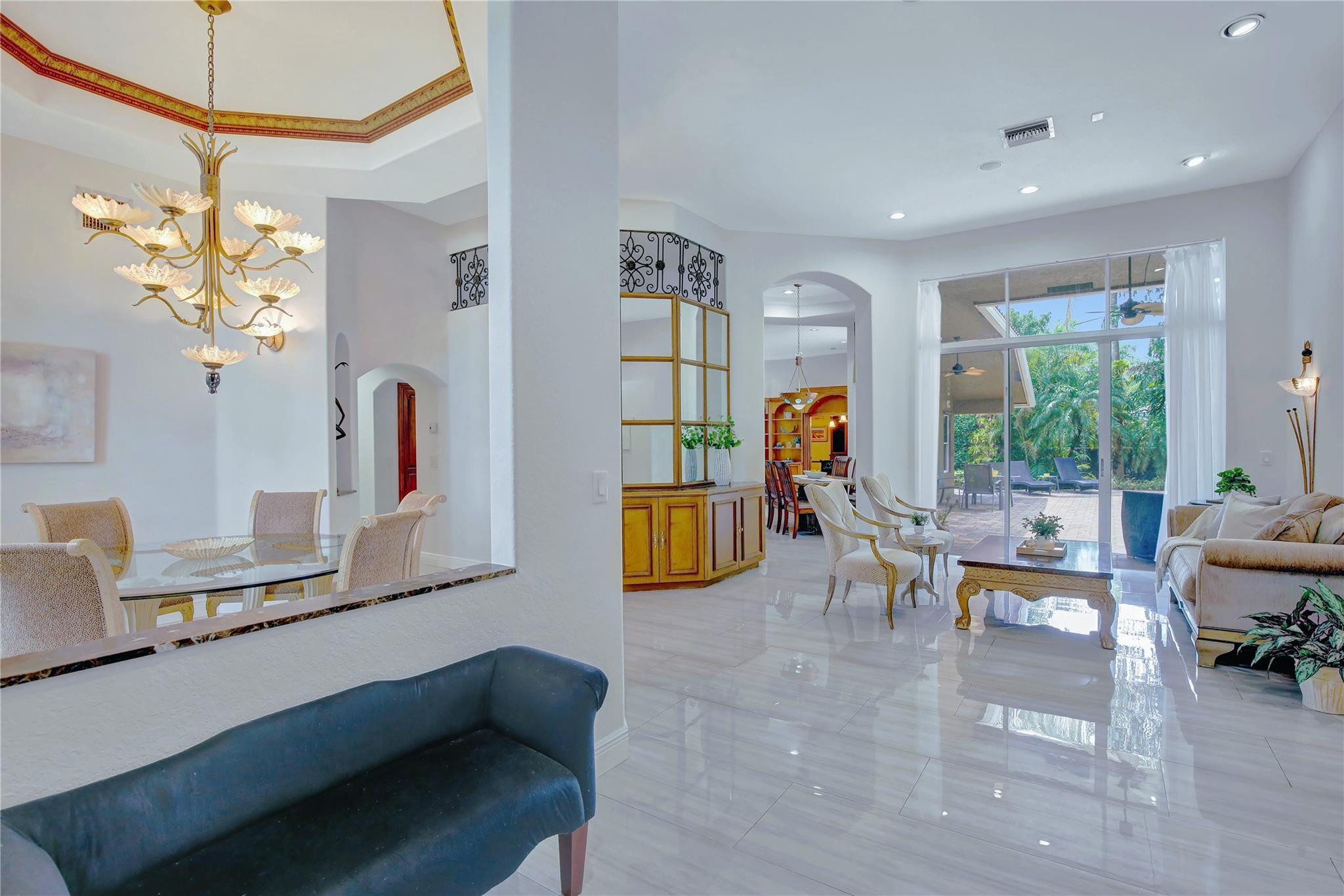 2529 Eagle Run Circle Fort Lauderdale, FL 33327 - Photo 16 of 74 a living room with furniture and a chandelier