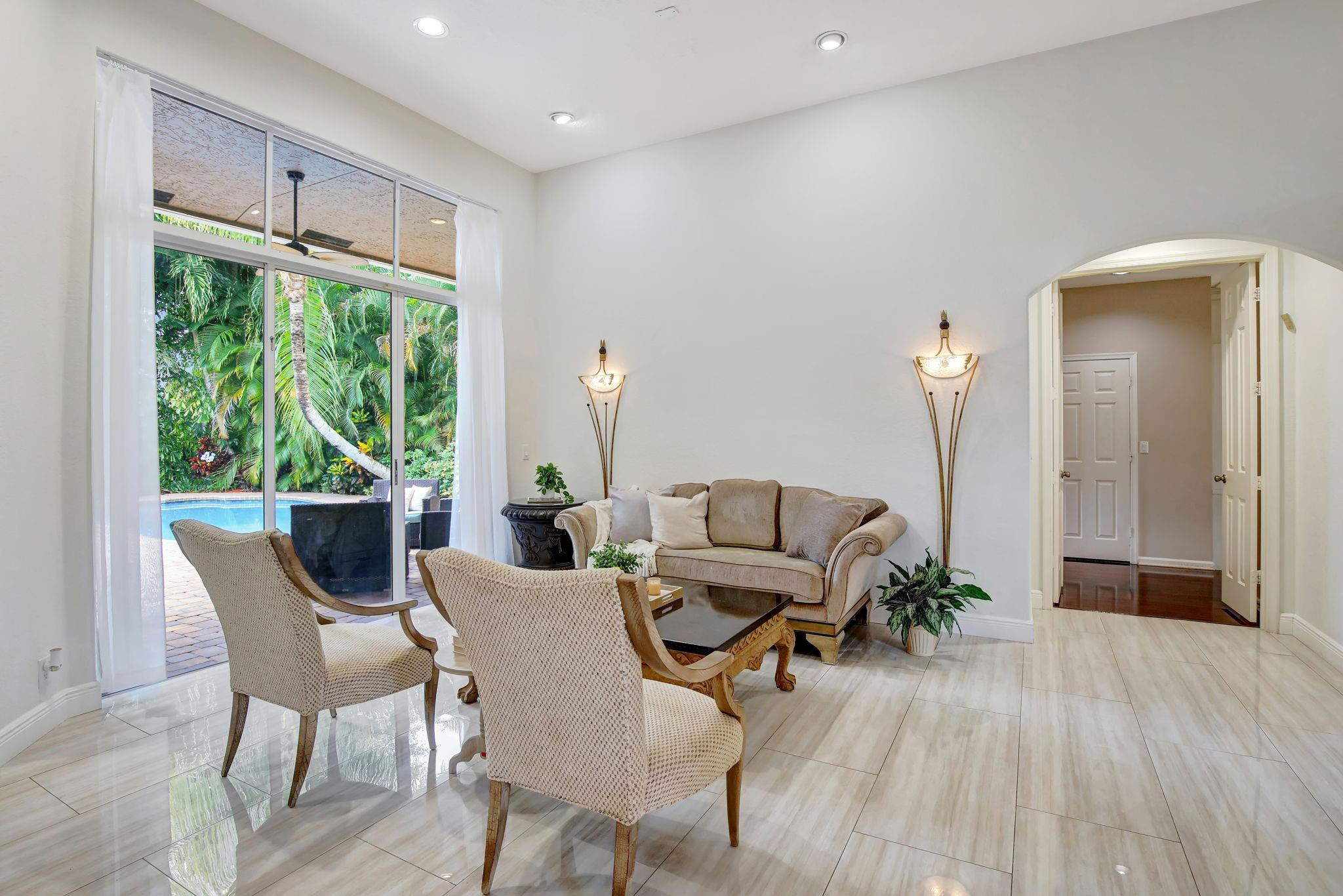 2529 Eagle Run Circle Fort Lauderdale, FL 33327 - Photo 17 of 74 a living room with furniture and a large window