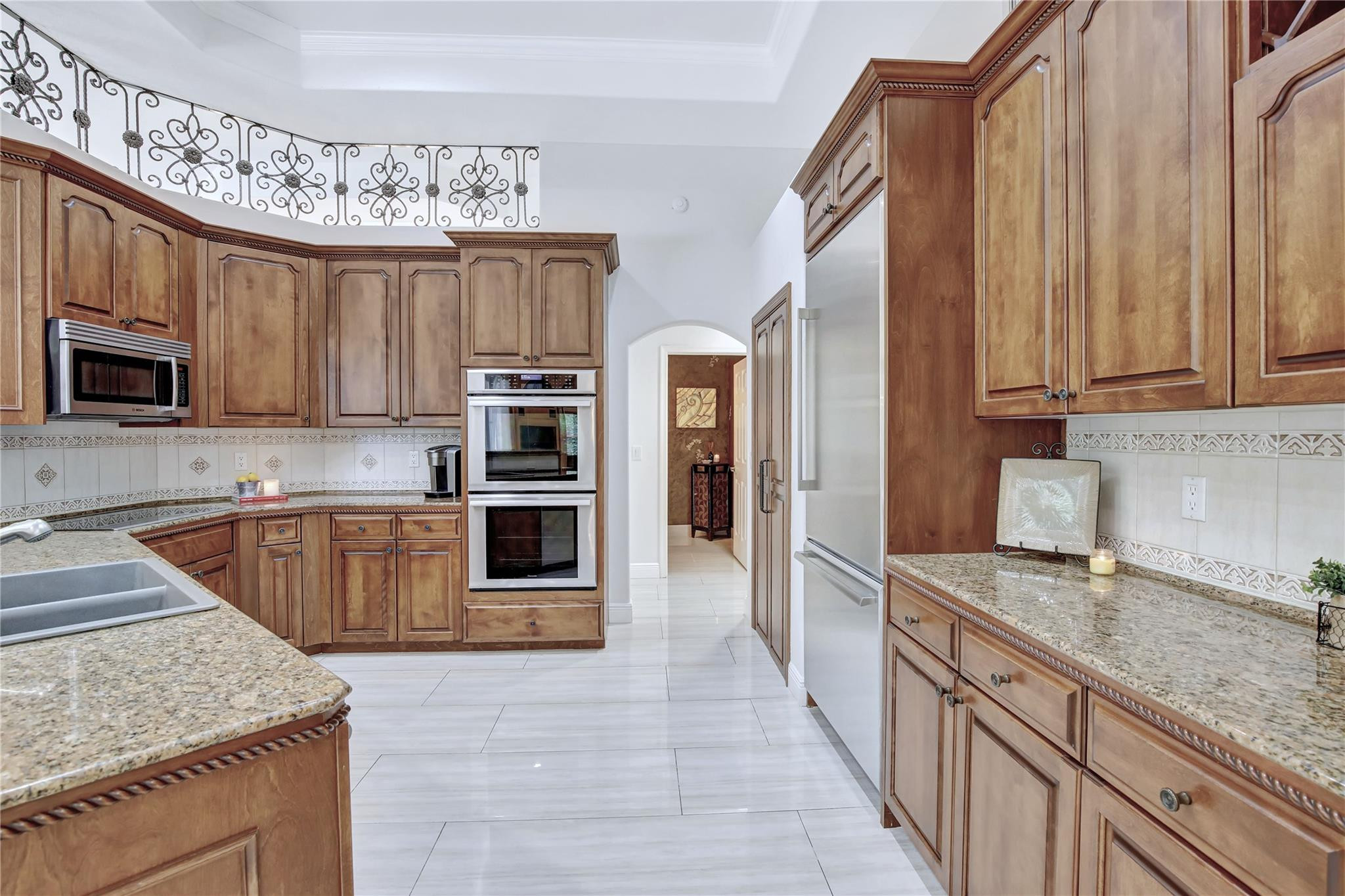 2529 Eagle Run Circle Fort Lauderdale, FL 33327 - Photo 21 of 74 a kitchen with stainless steel appliances granite countertop a sink stove microwave and refrigerator