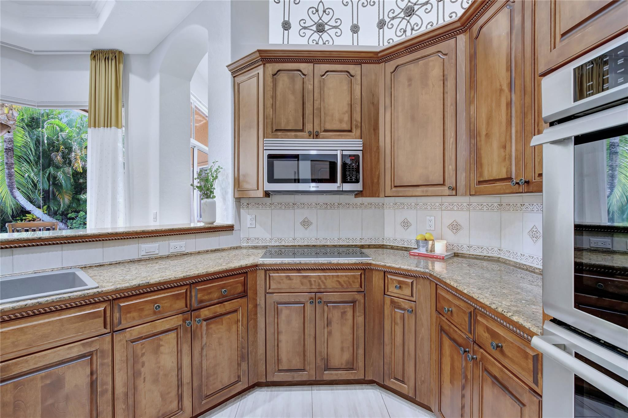 2529 Eagle Run Circle Fort Lauderdale, FL 33327 - Photo 23 of 74 a kitchen with stainless steel appliances granite countertop a stove a sink and a microwave