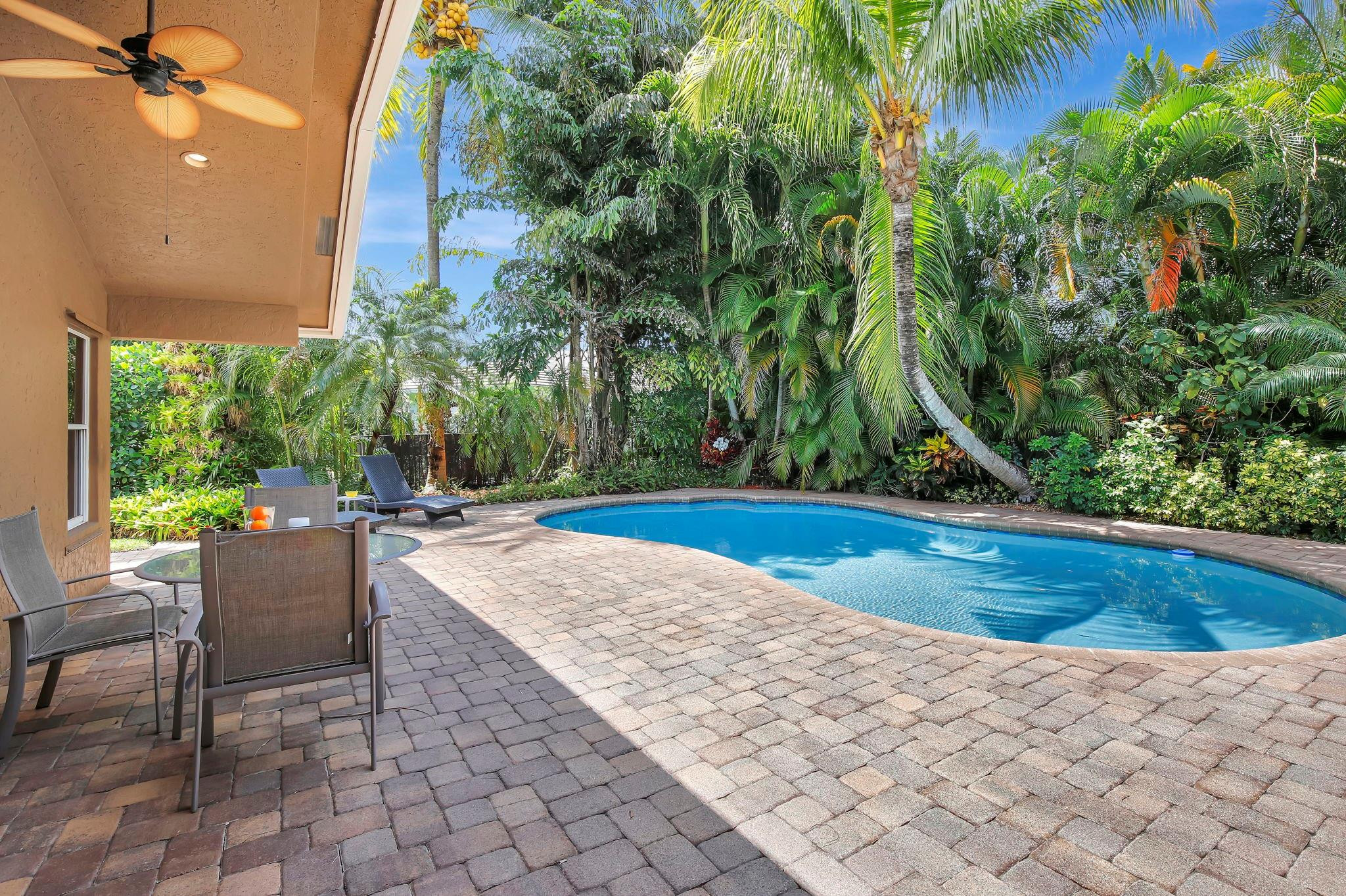 2529 Eagle Run Circle Fort Lauderdale, FL 33327 - Photo 3 of 74 a view of backyard with swimming pool and outdoor seating