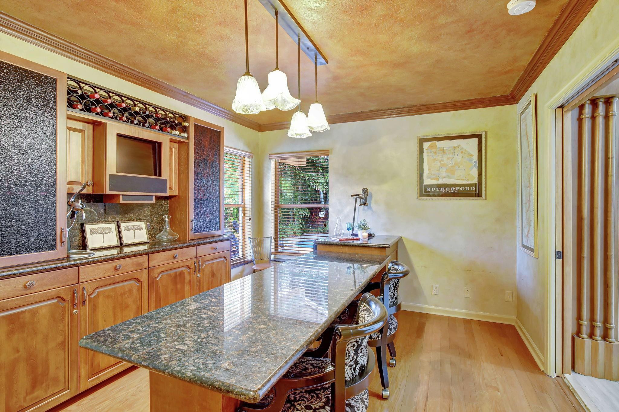 2529 Eagle Run Circle Fort Lauderdale, FL 33327 - Photo 31 of 74 a dining room with wooden floor and chandelier