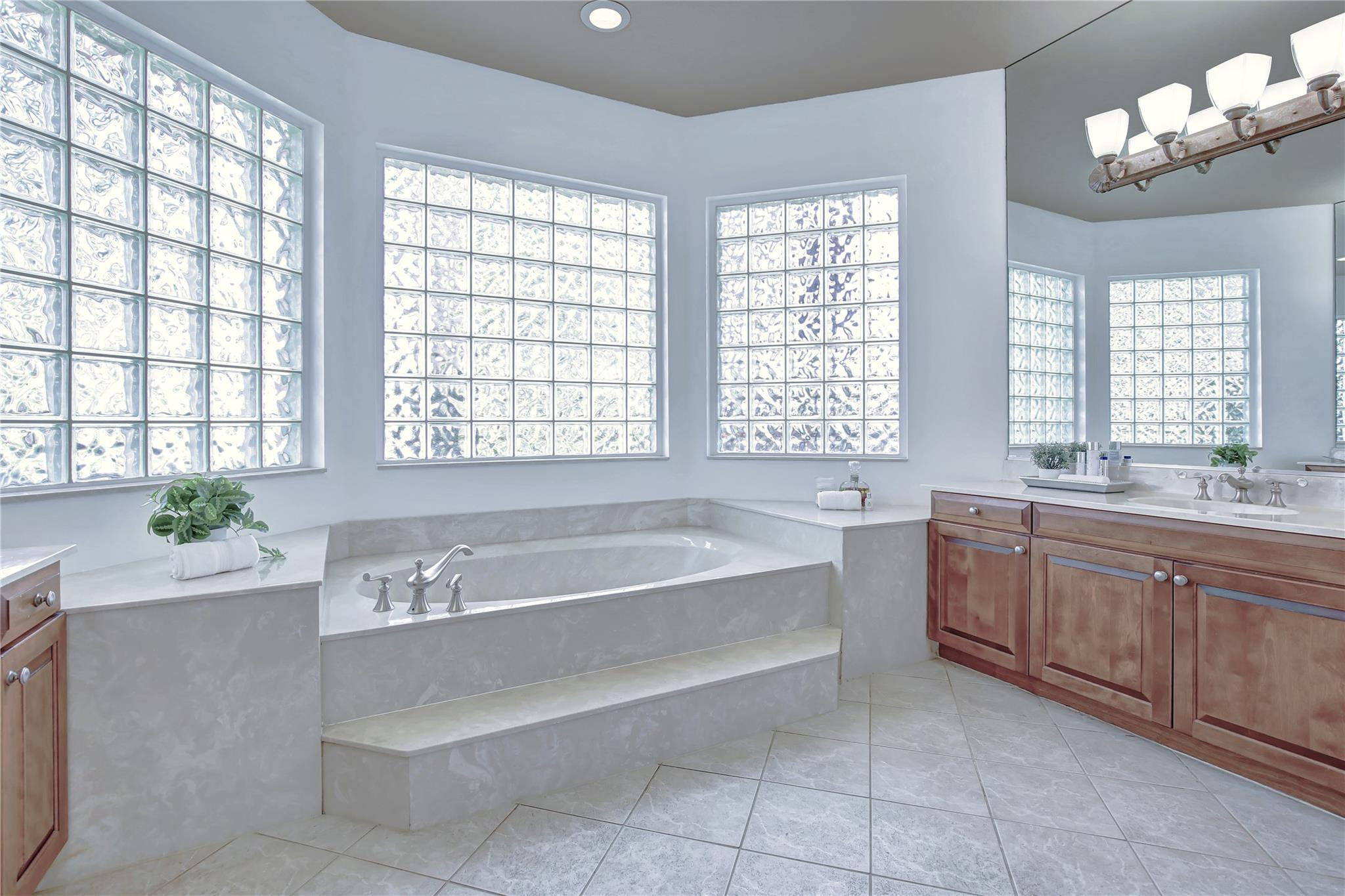 2529 Eagle Run Circle Fort Lauderdale, FL 33327 - Photo 45 of 74 a spacious bathroom with a bathtub a sink and a window