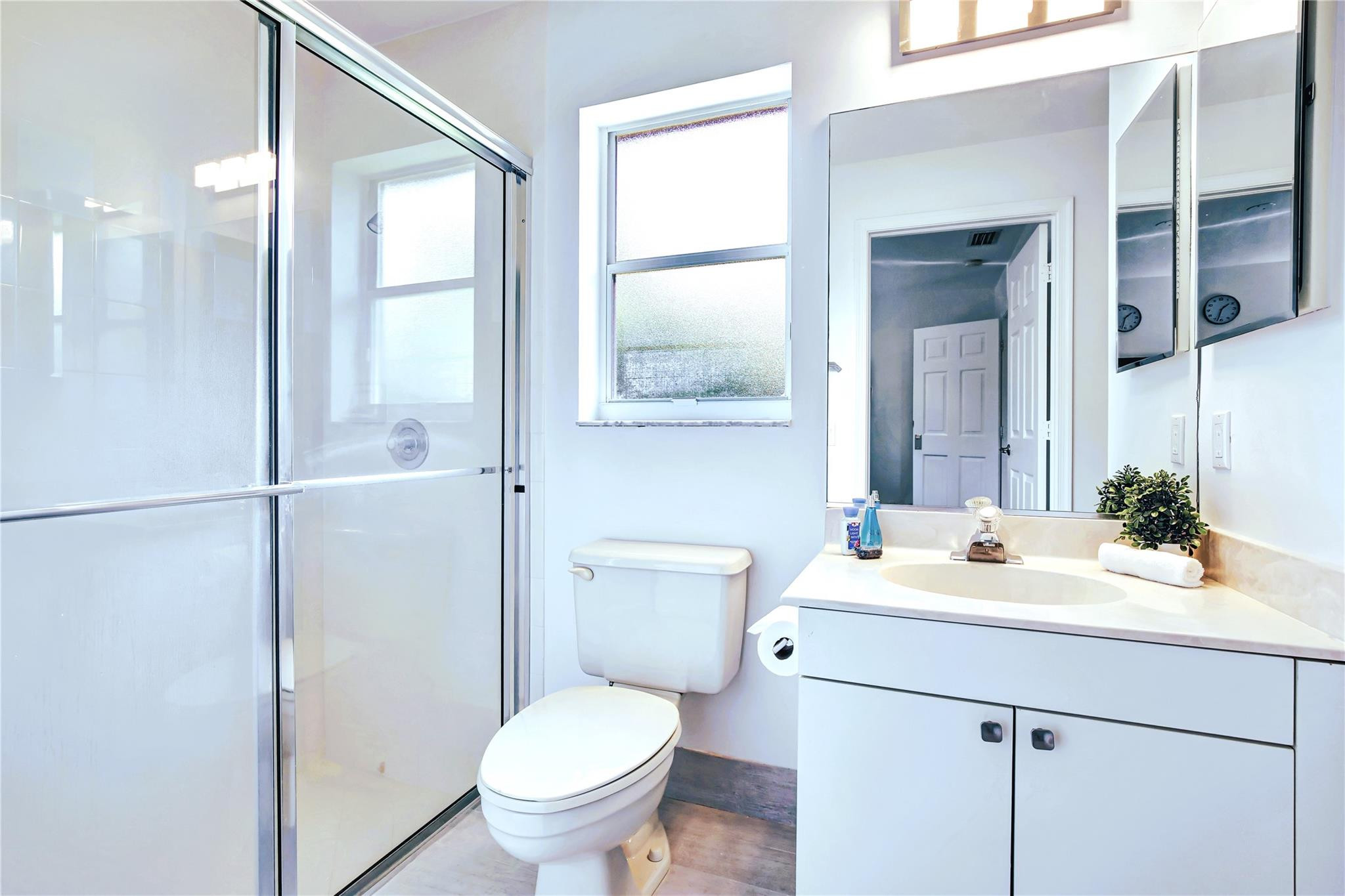 2529 Eagle Run Circle Fort Lauderdale, FL 33327 - Photo 51 of 74 a bathroom with a sink toilet vanity and shower