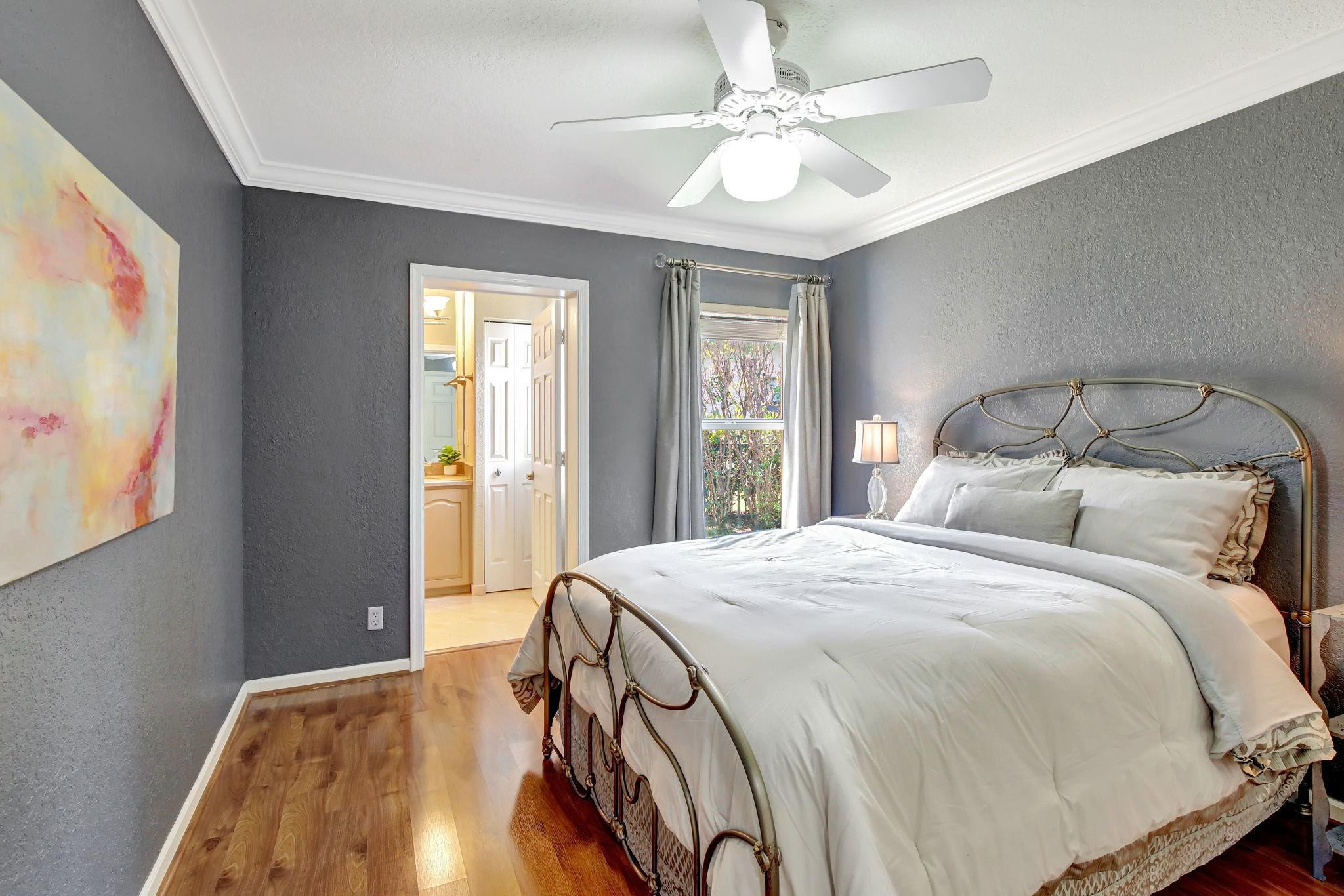 2529 Eagle Run Circle Fort Lauderdale, FL 33327 - Photo 55 of 74 a bedroom with a bed and a chandelier