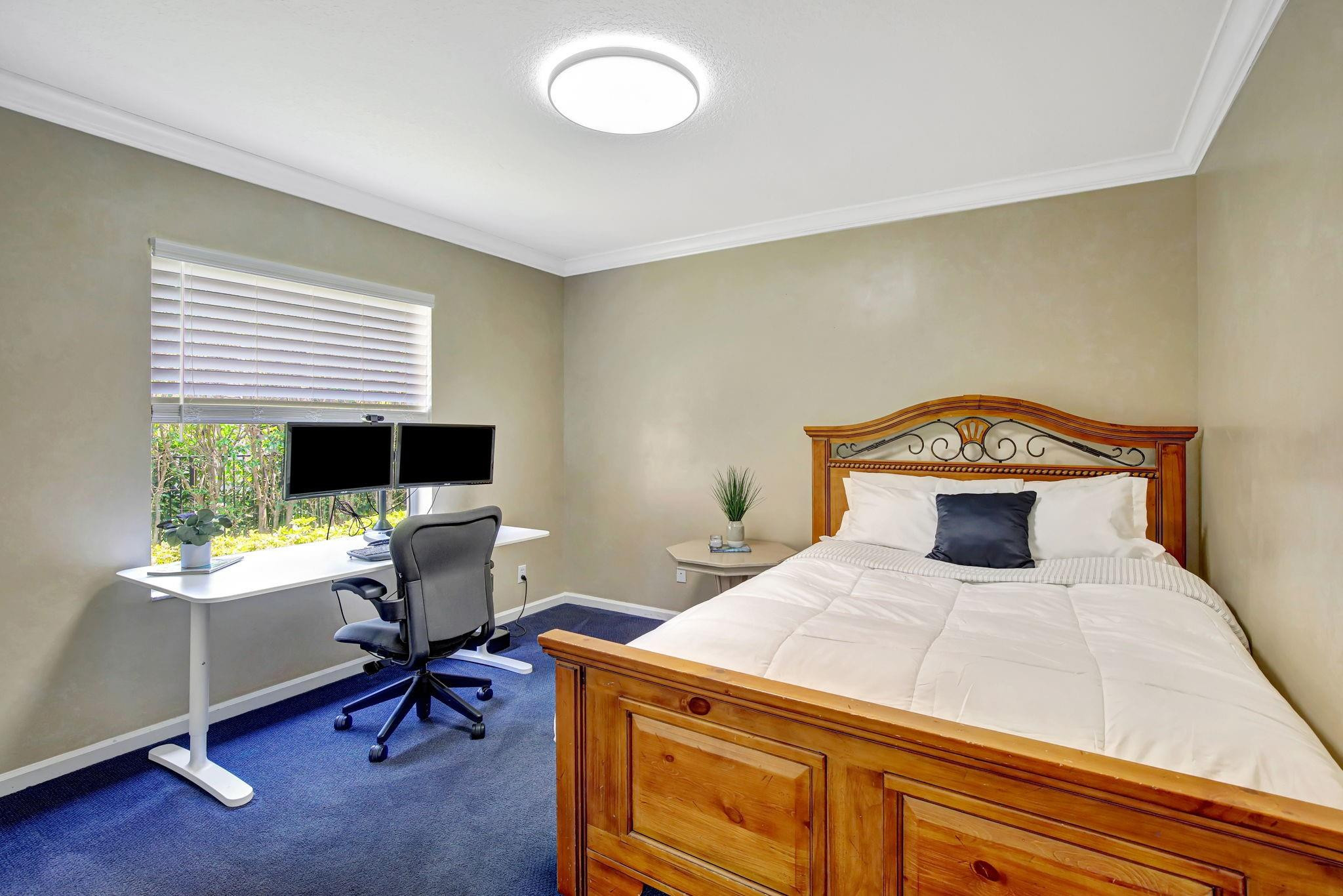 2529 Eagle Run Circle Fort Lauderdale, FL 33327 - Photo 58 of 74 a bedroom with a bed and a desk