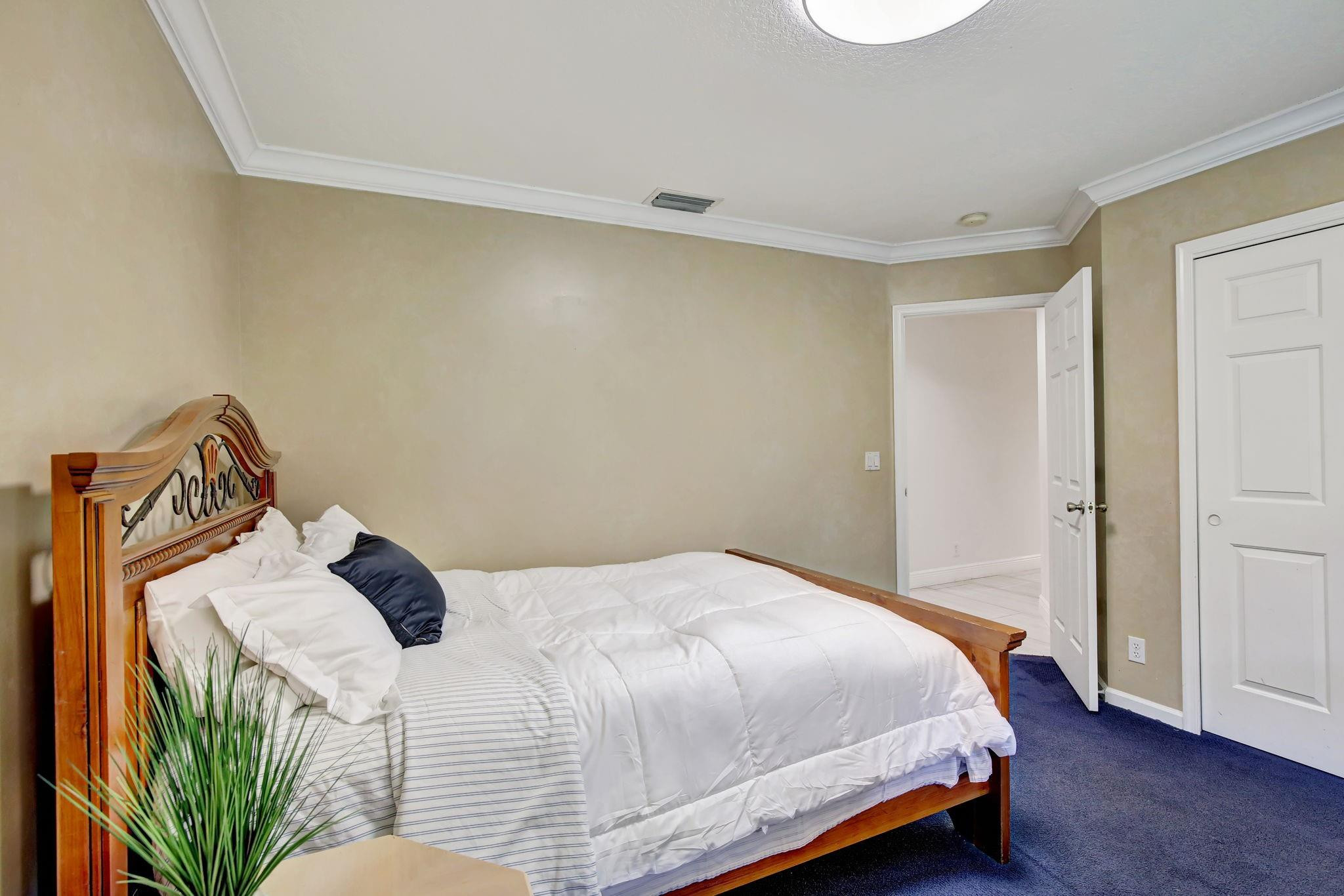 2529 Eagle Run Circle Fort Lauderdale, FL 33327 - Photo 60 of 74 a bedroom with a bed and a window