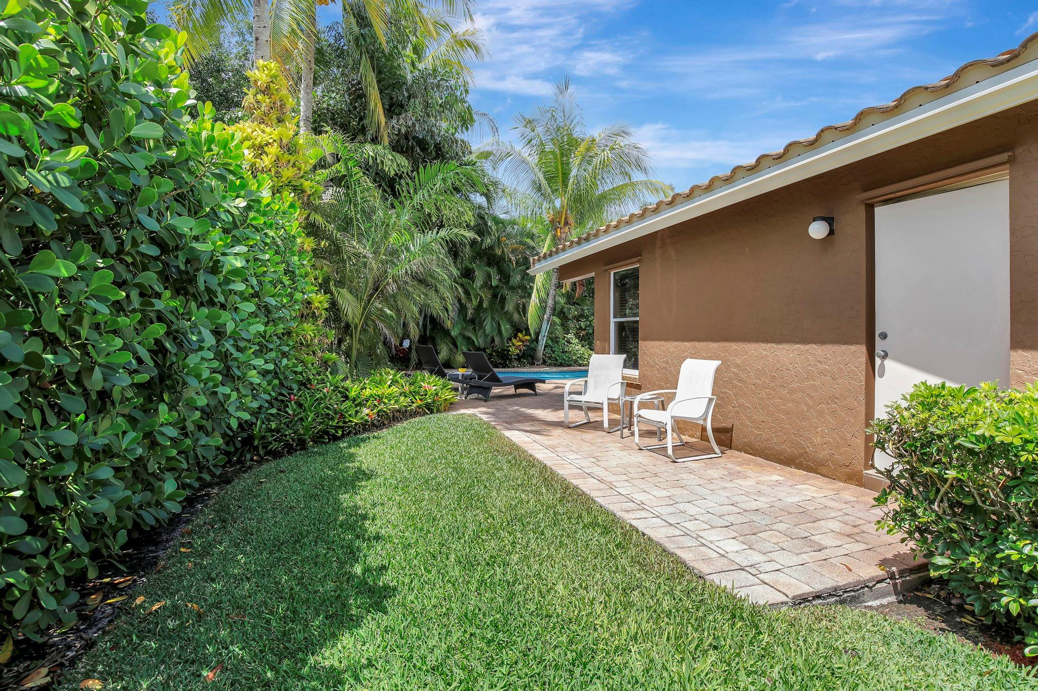 2529 Eagle Run Circle Fort Lauderdale, FL 33327 - Photo 61 of 74 a view of backyard of house with outdoor seating and green space