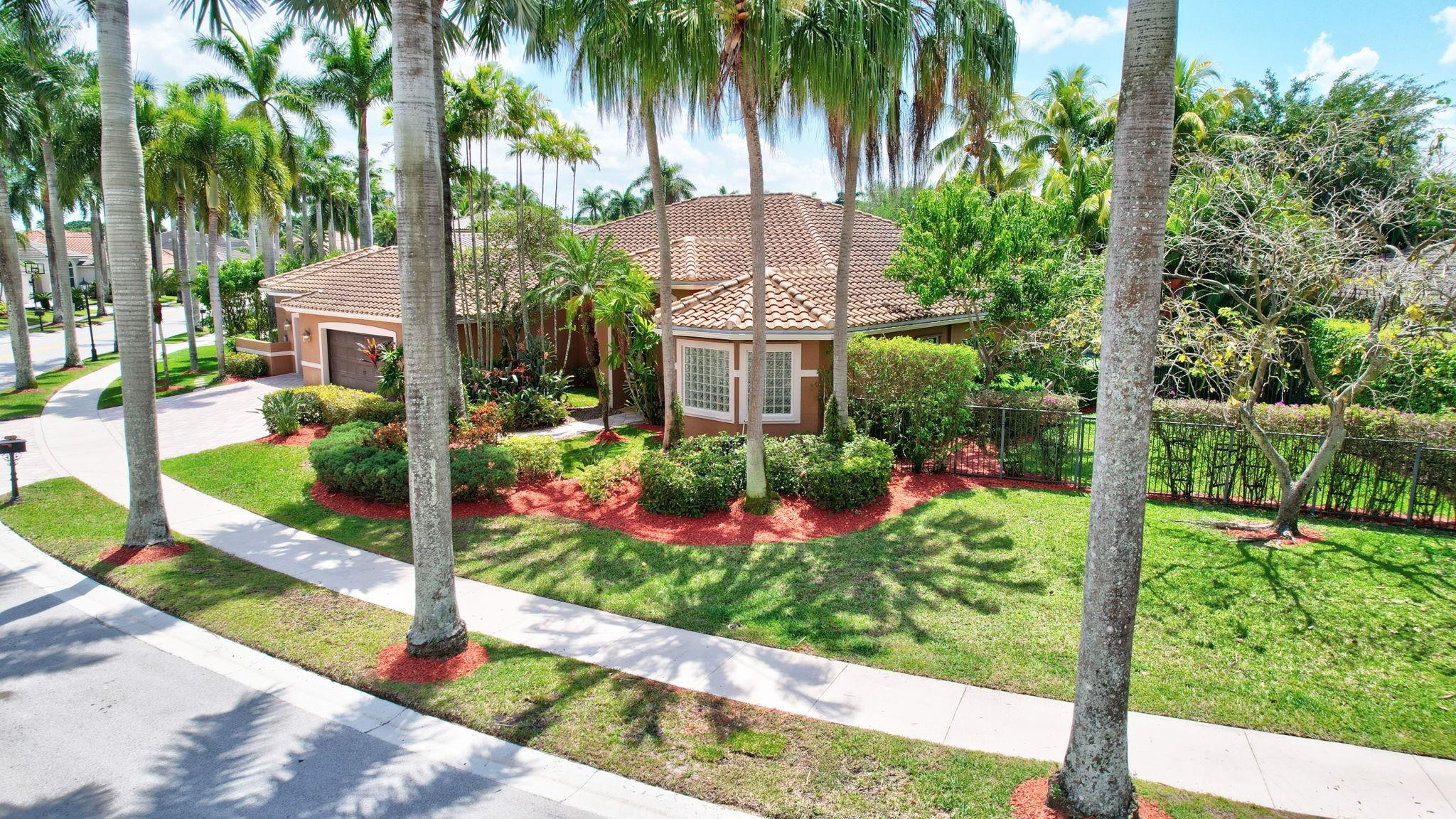 2529 Eagle Run Circle Fort Lauderdale, FL 33327 - Photo 73 of 74 a view of a garden in front of a house