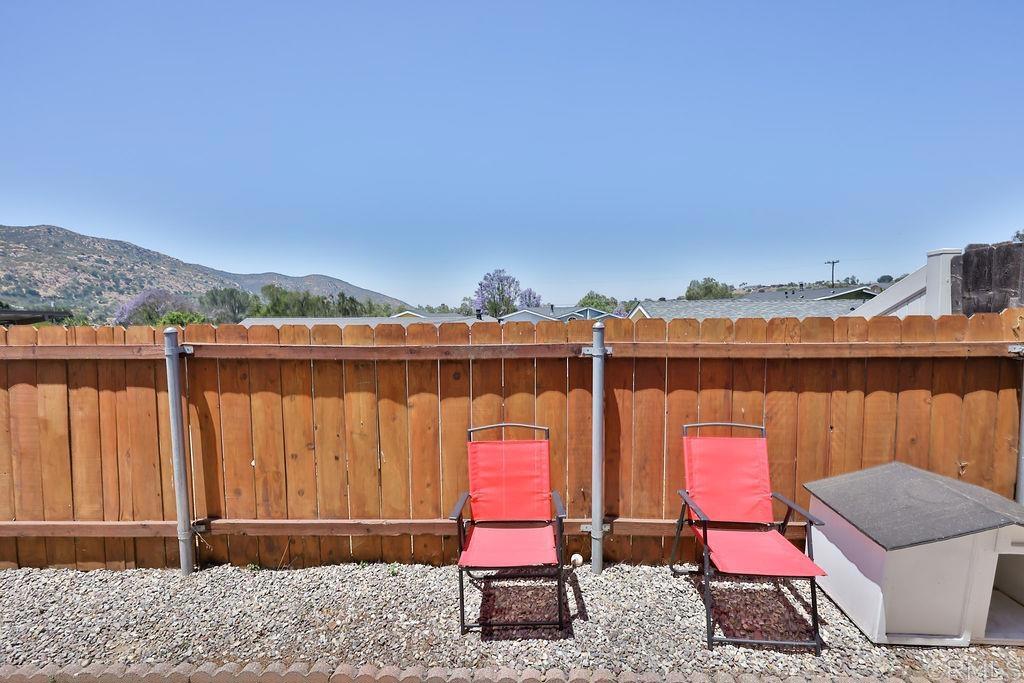15935 Spring Oaks Road, Unit 107 El Cajon, CA 92021 - Photo 12 of 23 a backyard of a house with seating space