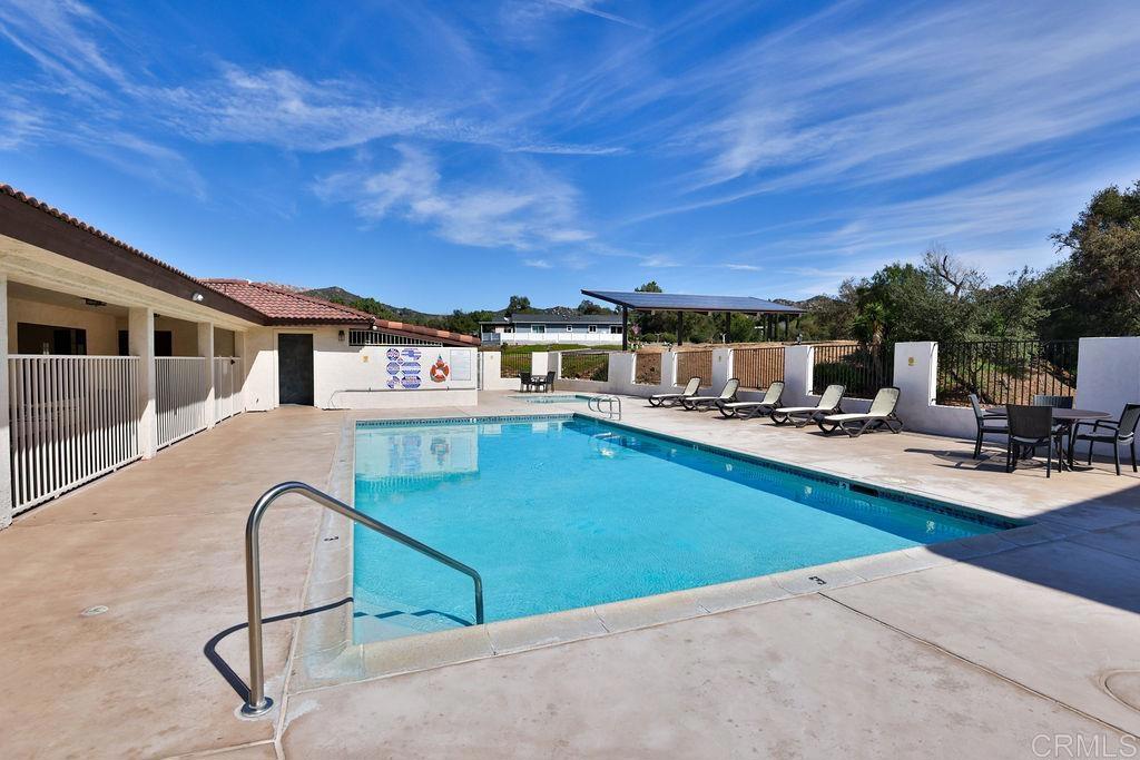 15935 Spring Oaks Road, Unit 107 El Cajon, CA 92021 - Photo 20 of 23 a view of a patio with swimming pool
