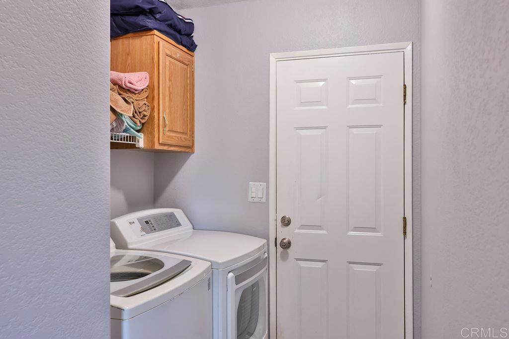 15935 Spring Oaks Road, Unit 107 El Cajon, CA 92021 - Photo 10 of 23 a utility room with dryer and washer