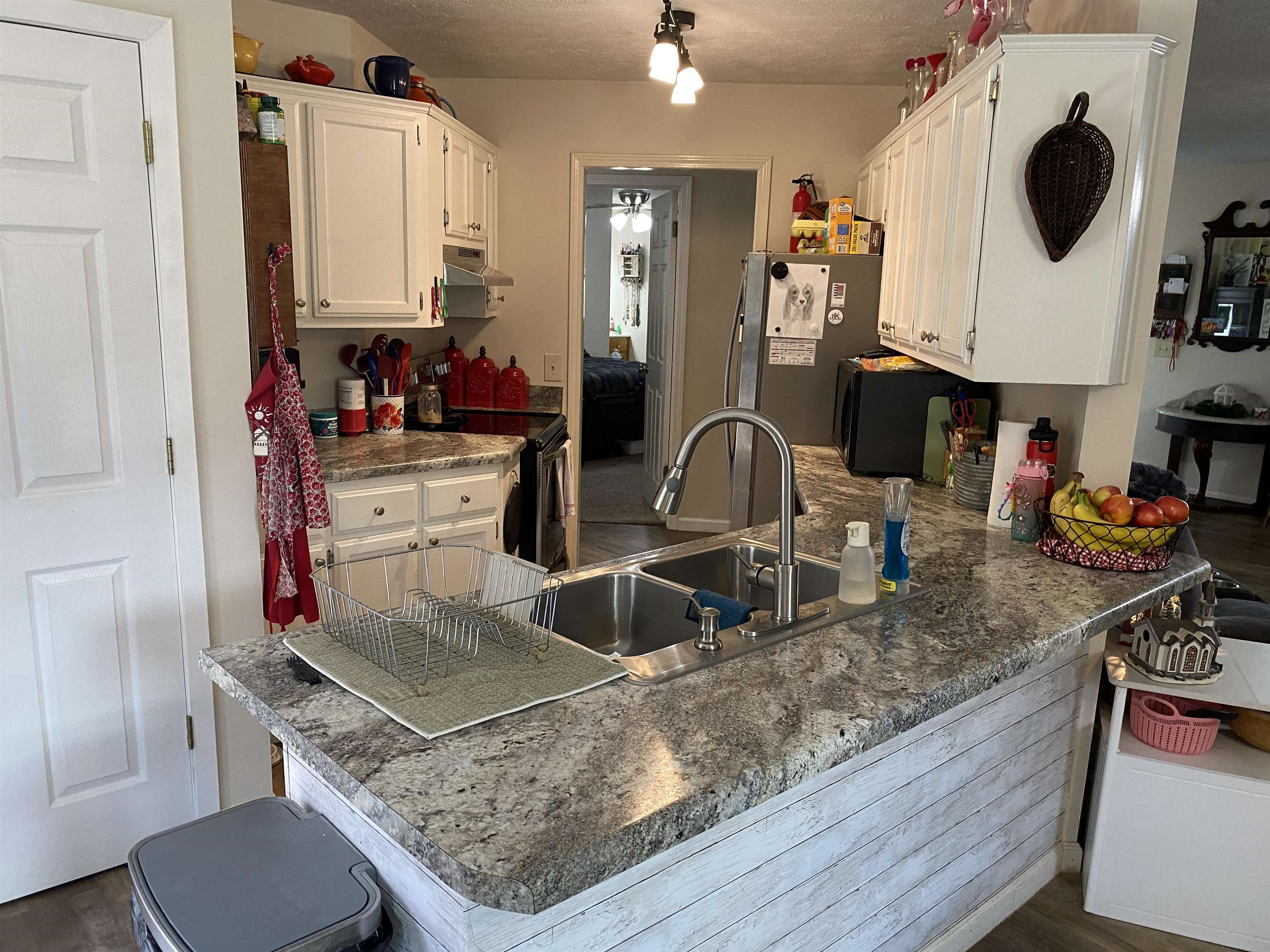 140 Ancil Way Savannah, TN 38372 - Photo 14 of 37 a kitchen with stainless steel appliances granite countertop a sink and a stove