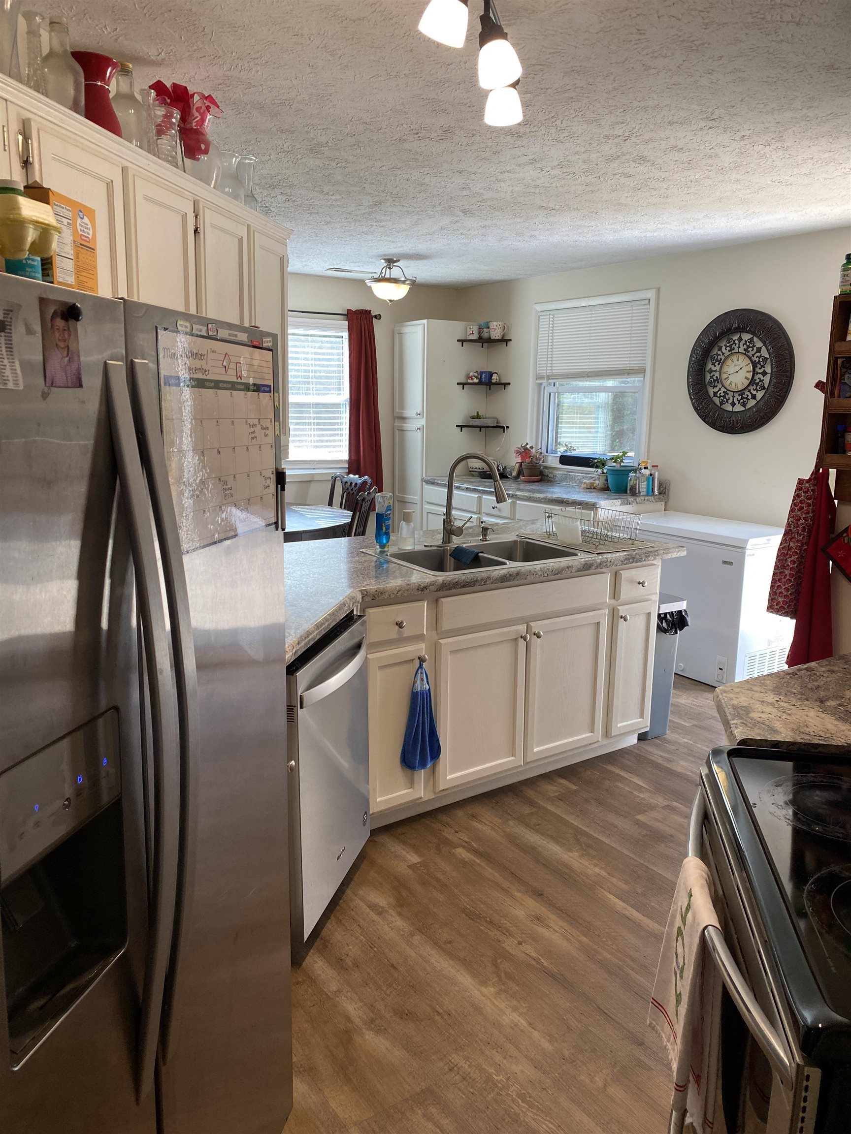 140 Ancil Way Savannah, TN 38372 - Photo 17 of 37 a kitchen with stainless steel appliances granite countertop a stove a sink dishwasher and a refrigerator
