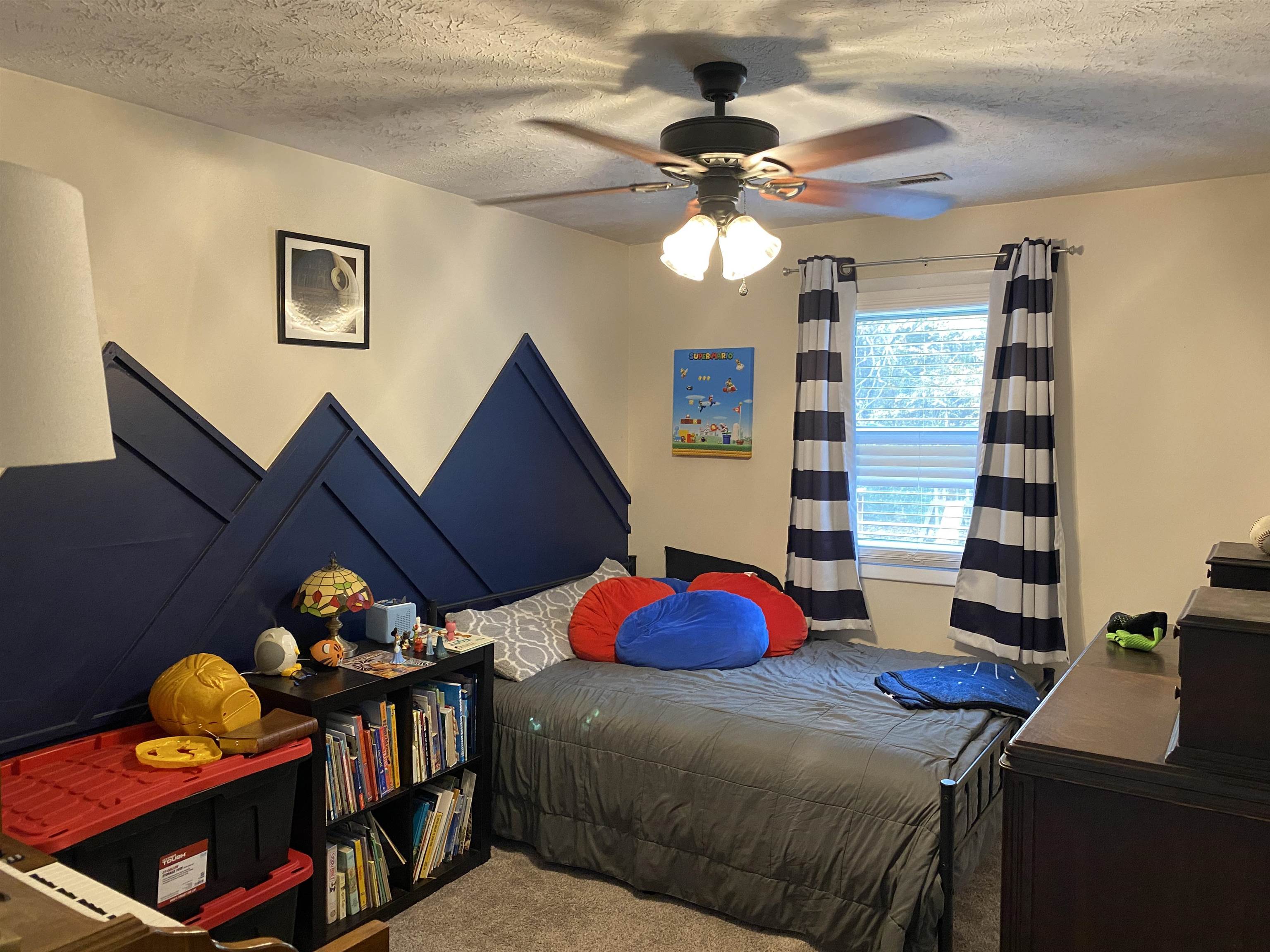 140 Ancil Way Savannah, TN 38372 - Photo 23 of 37 a bedroom with a bed and dresser