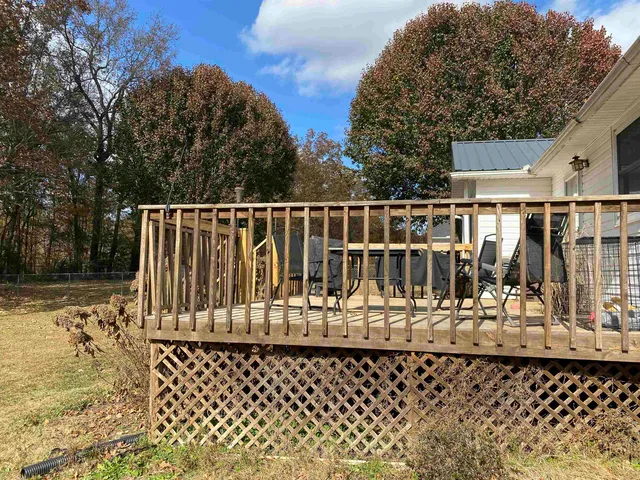 a view of a chairs and table on the deck