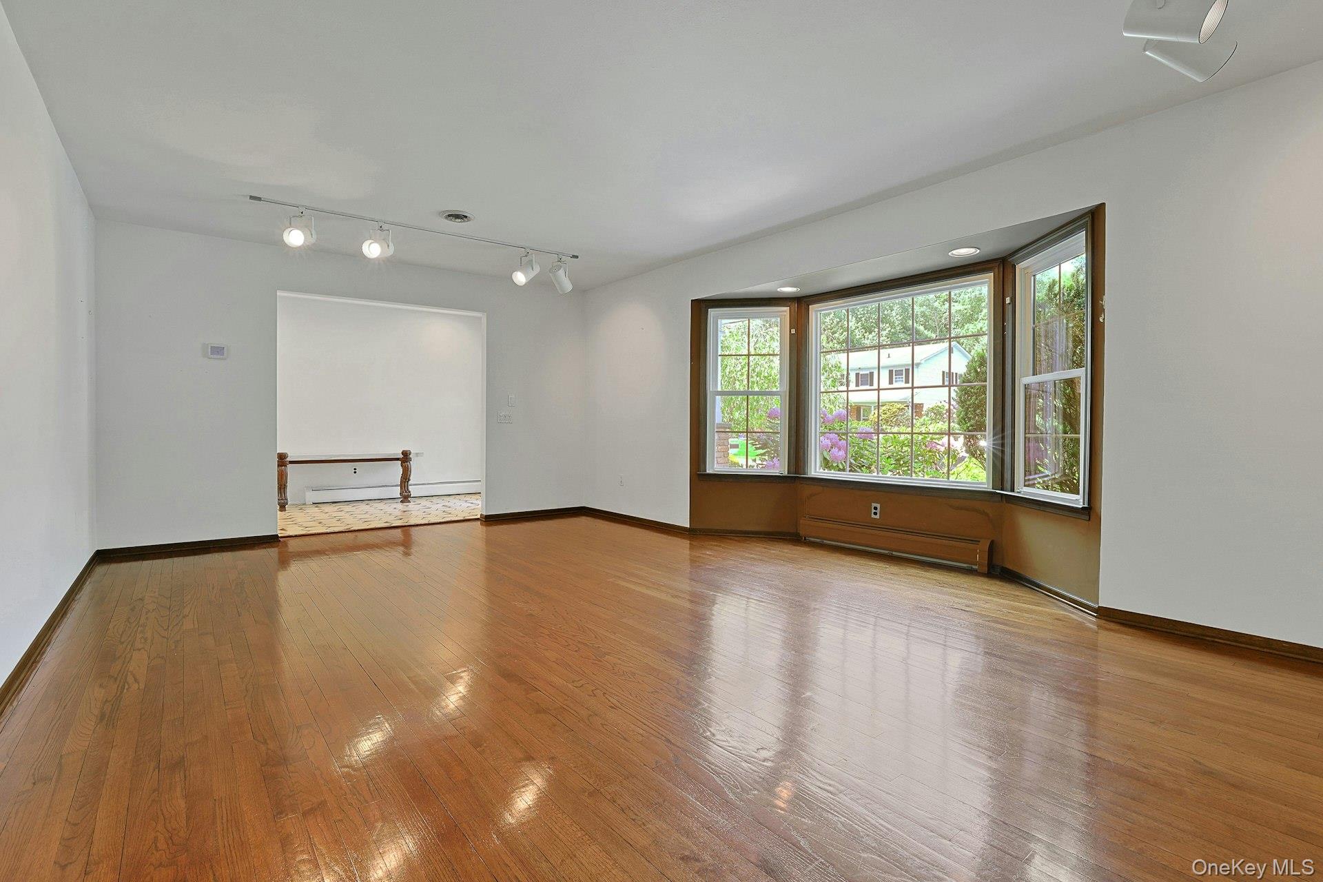 44 Ruth Drive New City, NY 10956 - Photo 5 of 40 Spacious living room with bay window & hardwood flooring