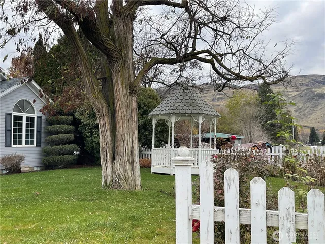 a front view of house with a garden