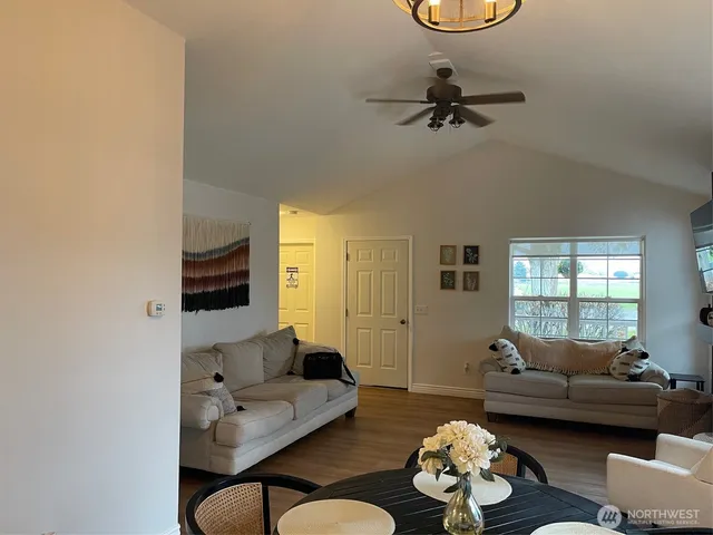 a living room with furniture and a window