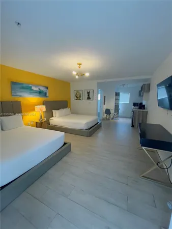 a bedroom with bed and window