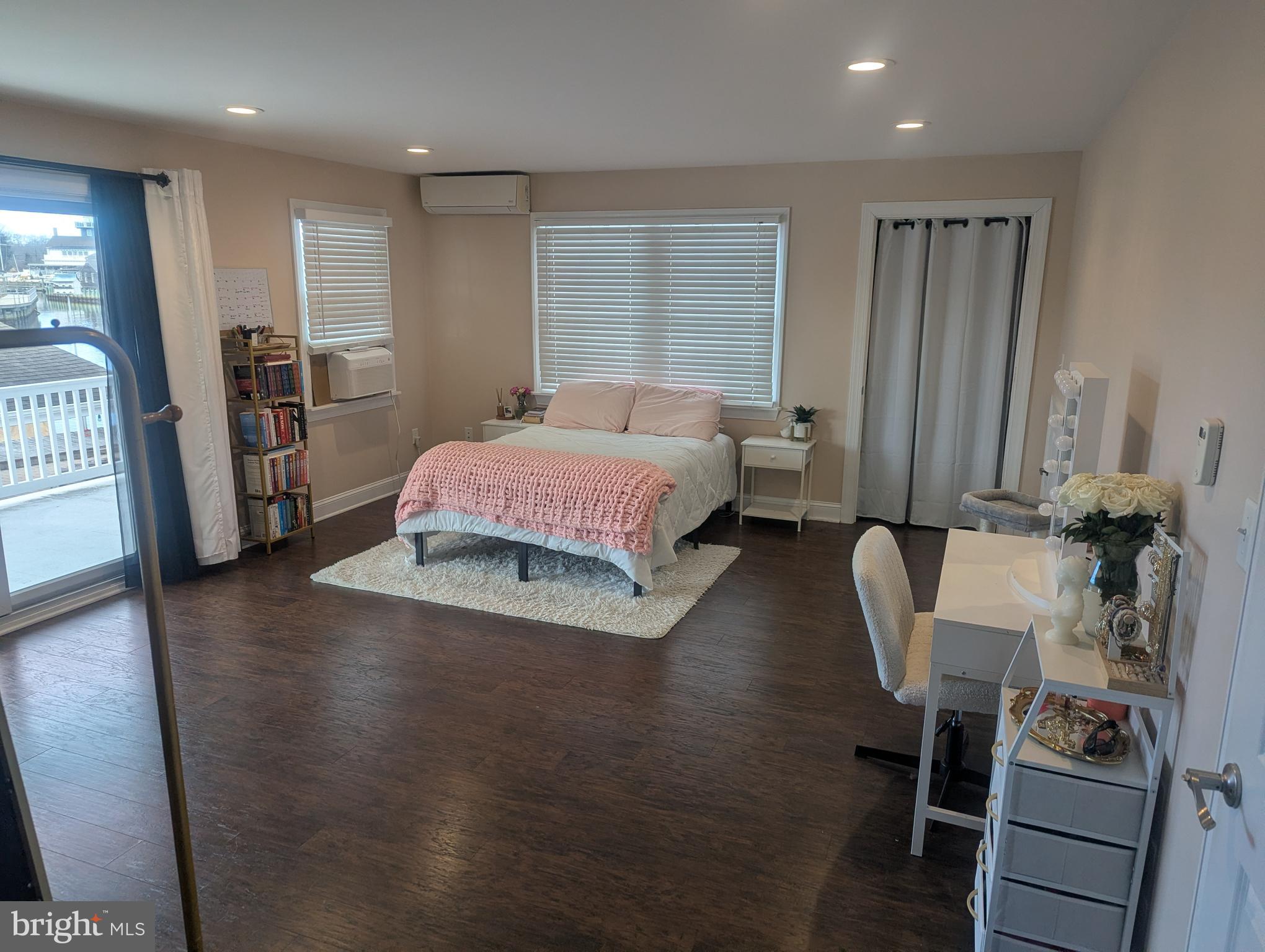 230 South Green Street Tuckerton, NJ 08087 - Photo 25 of 72 a spacious bedroom with a bed a table and a large mirror