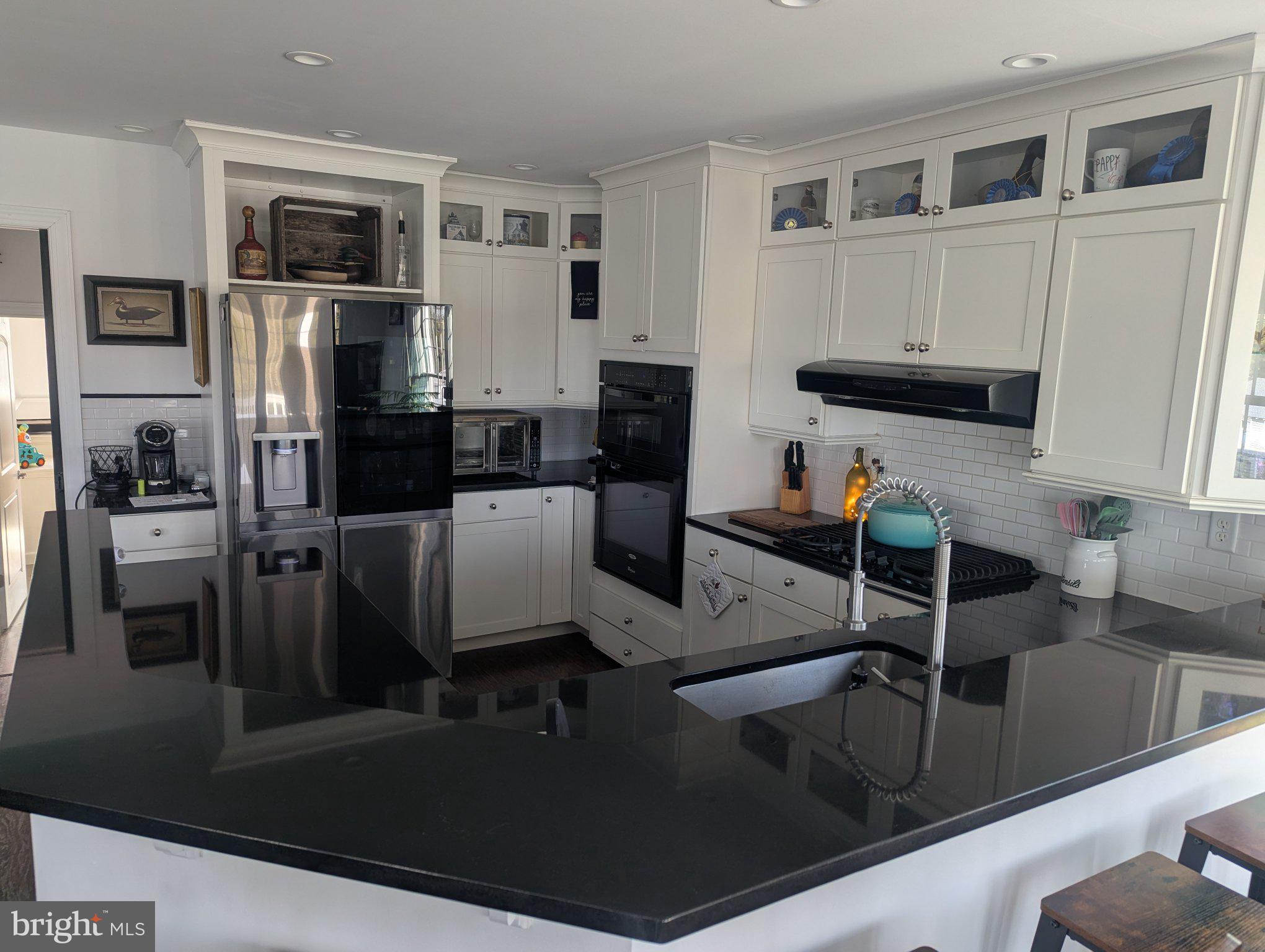 230 South Green Street Tuckerton, NJ 08087 - Photo 34 of 72 a kitchen with stainless steel appliances granite countertop a refrigerator and a stove