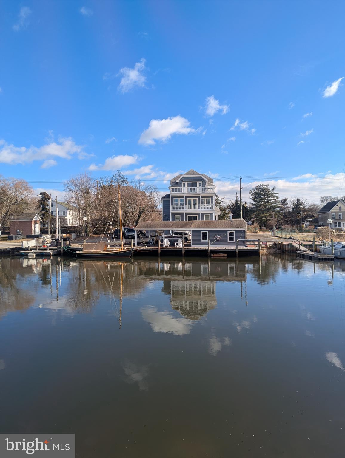 230 South Green Street Tuckerton, NJ 08087 - Photo 4 of 72 a view of a lake with boats and trees in the background