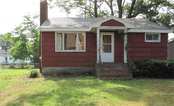 10 Stacy Street Randolph, MA 02368 - Photo 2 of 8 a front view of a house with garden